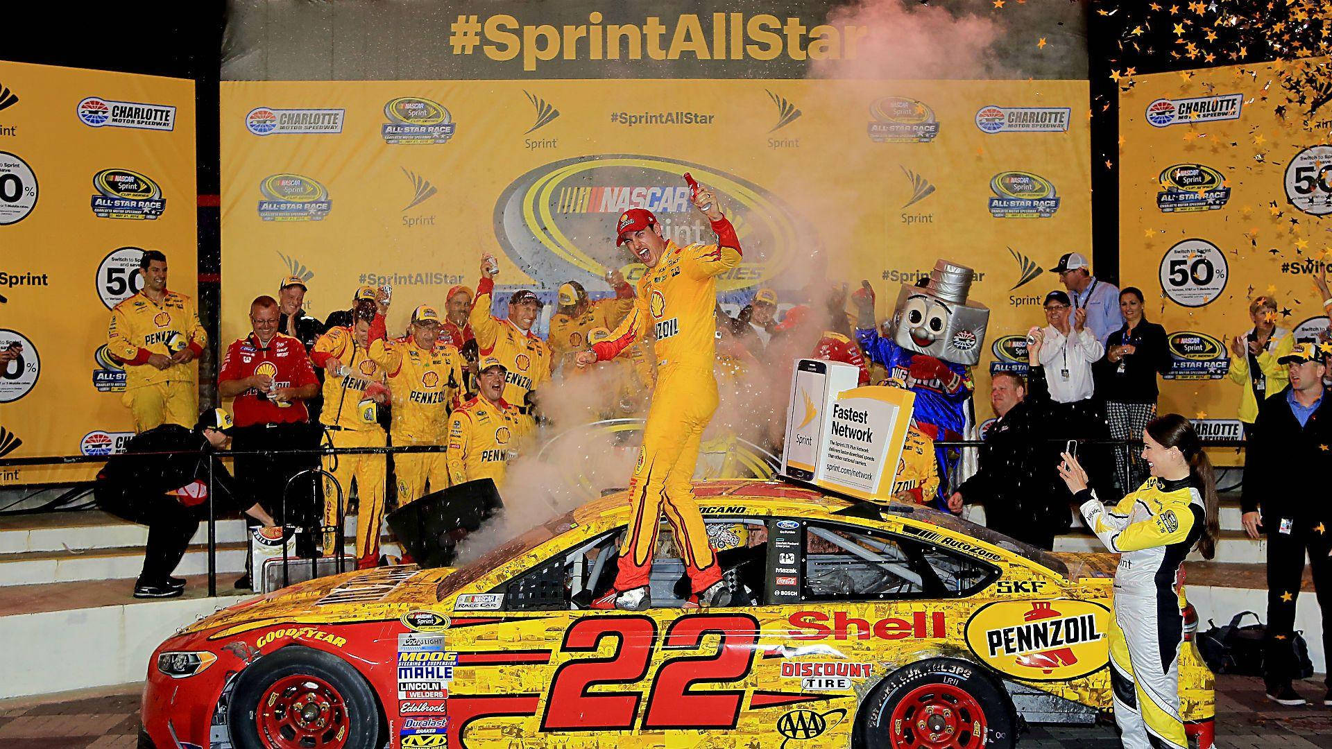 Joey Logano Celebrating Victory With His Team