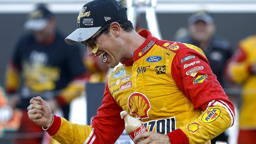 Joey Logano Holding Soft Drink