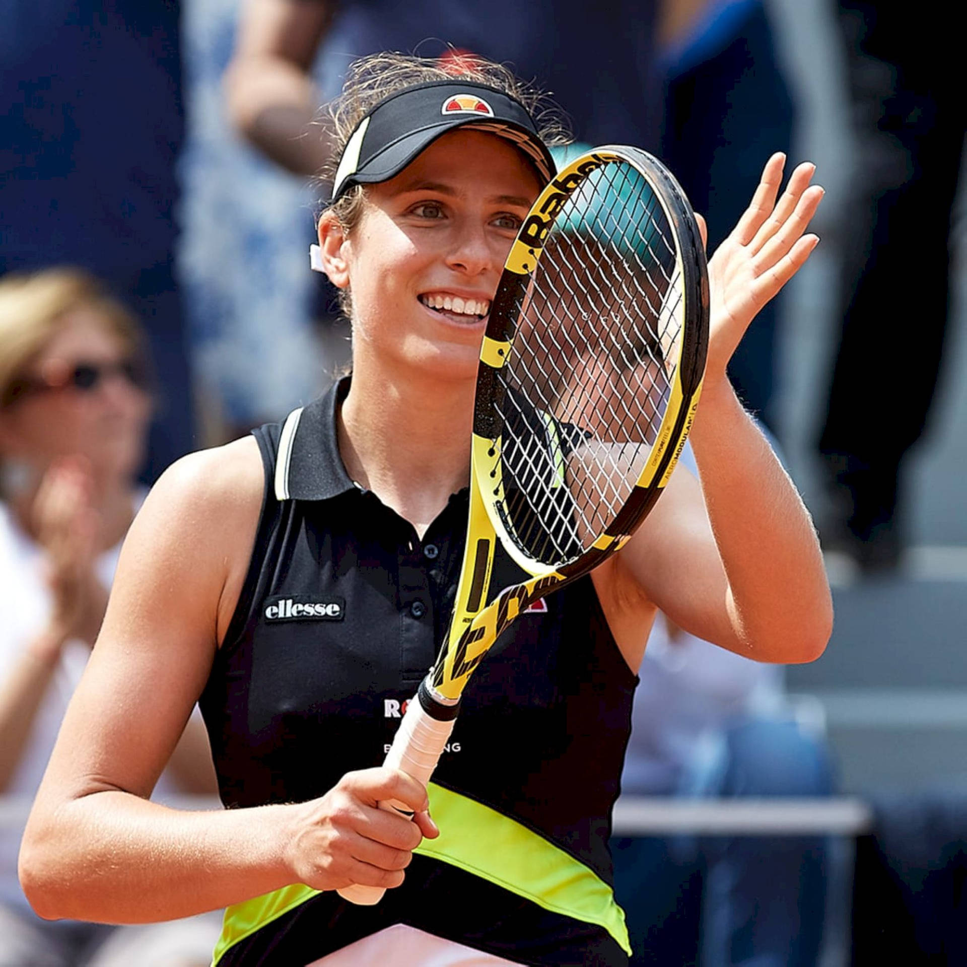 Johanna Konta Applauding Crowds With Tennis Racket Background