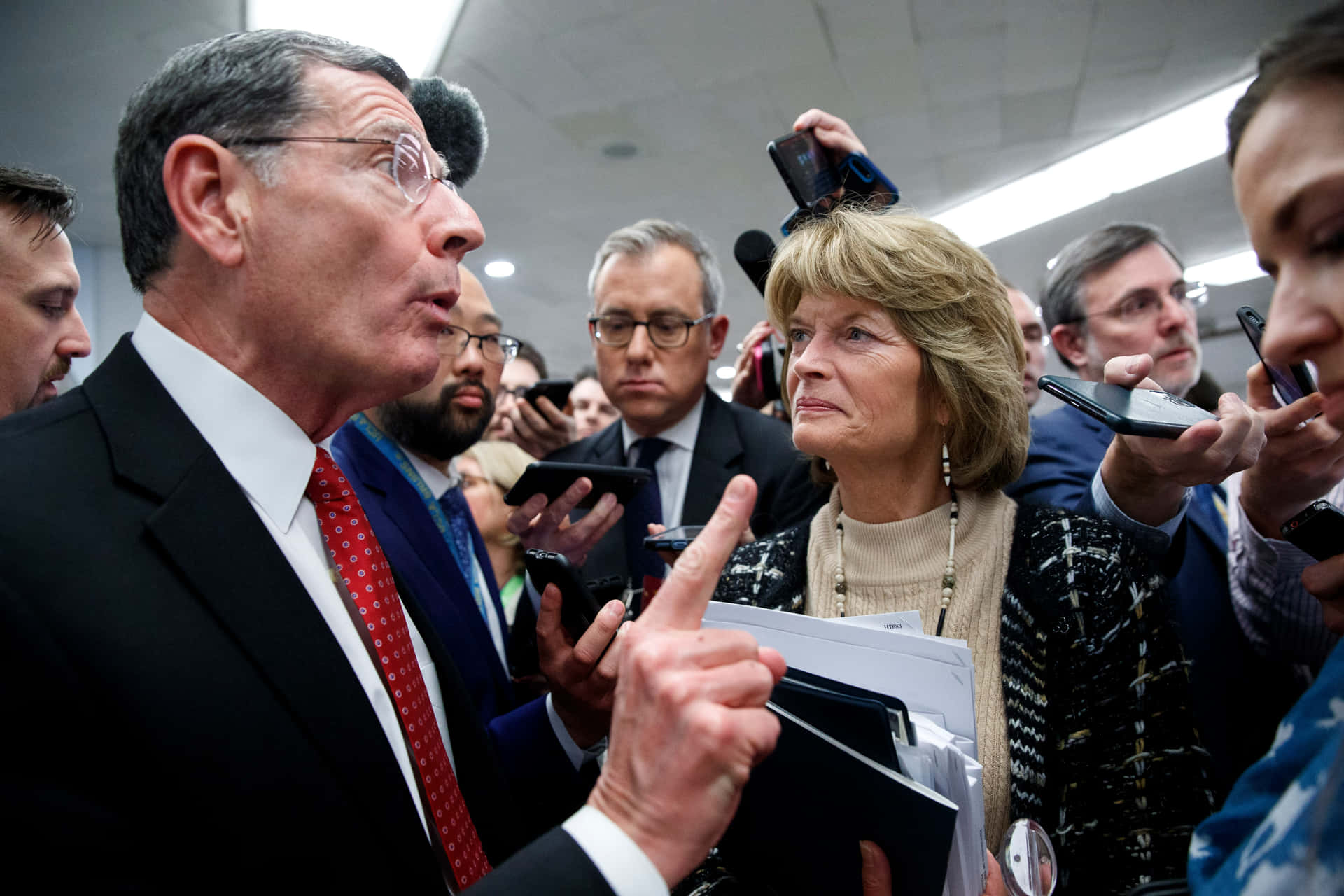 John Barrasso Surrounded By Reporters Background
