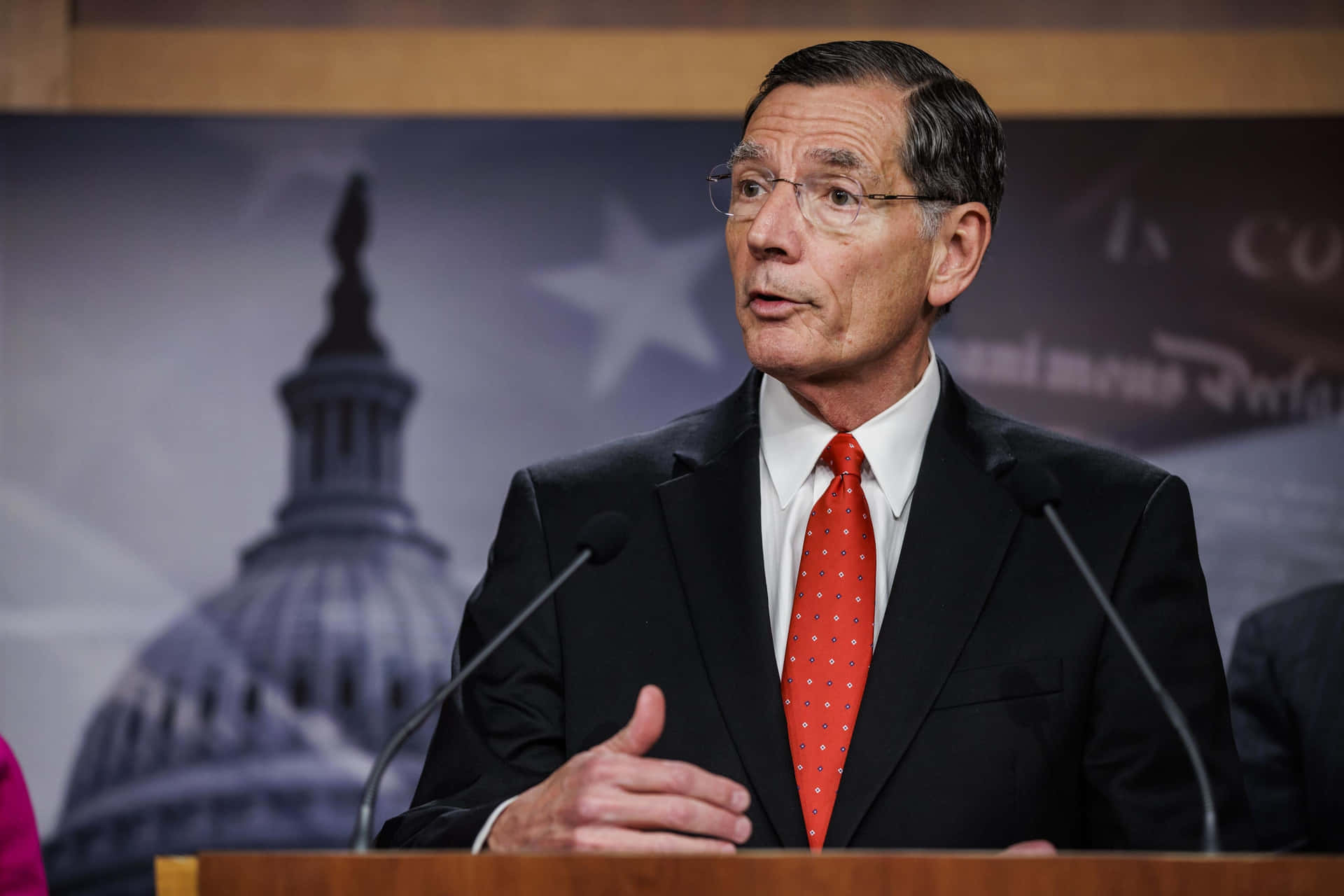 John Barrasso With Capitol Background Background
