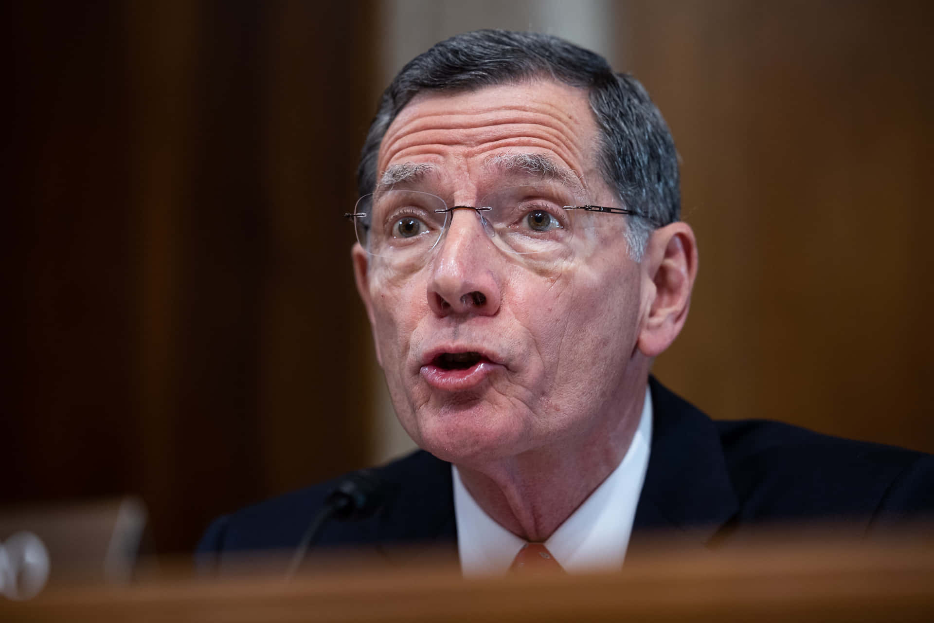 John Barrasso With Pouting Lips Background