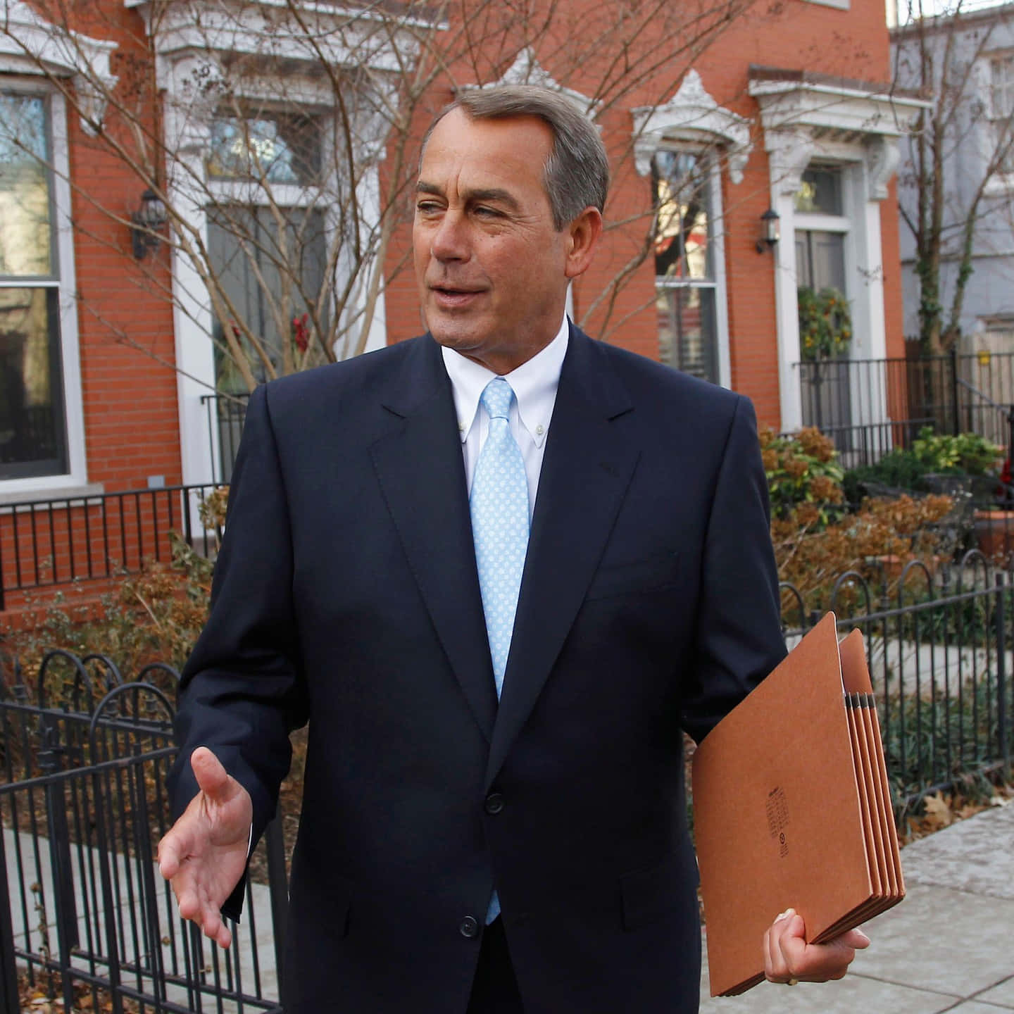 John Boehner Holding Folders At The Office Background