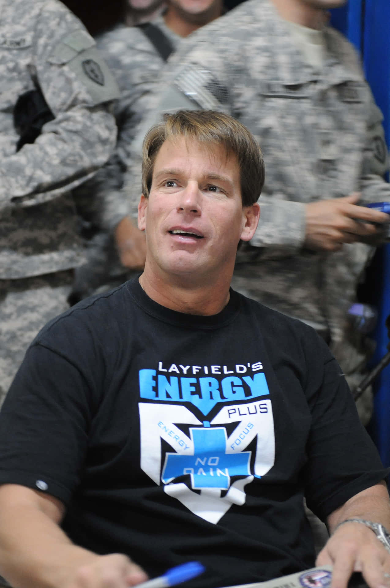 John Bradshaw Layfield Engaging With Soldiers Background