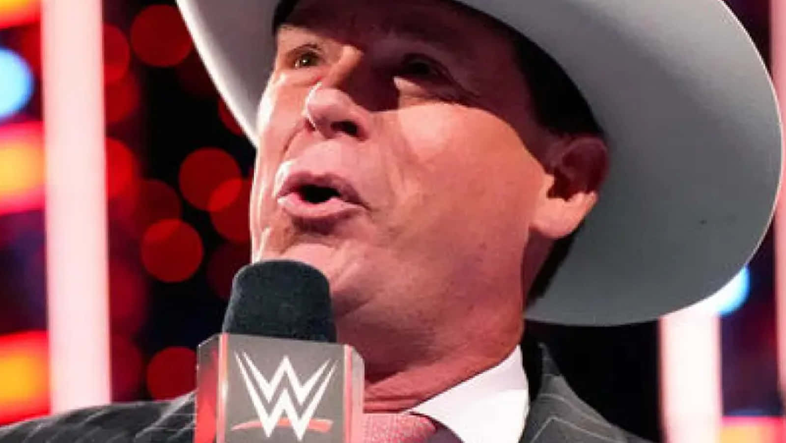 John Bradshaw Layfield In His Distinctive Cowboy Hat, A Pivotal Figure In Wwe History. Background