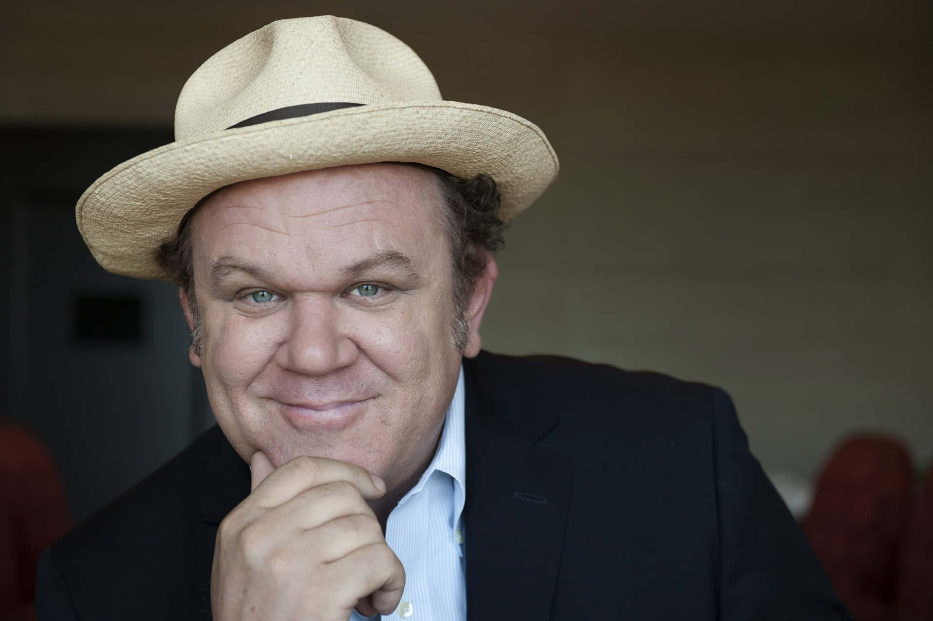 John C. Reilly Posing In A Stylish Photoshoot Background