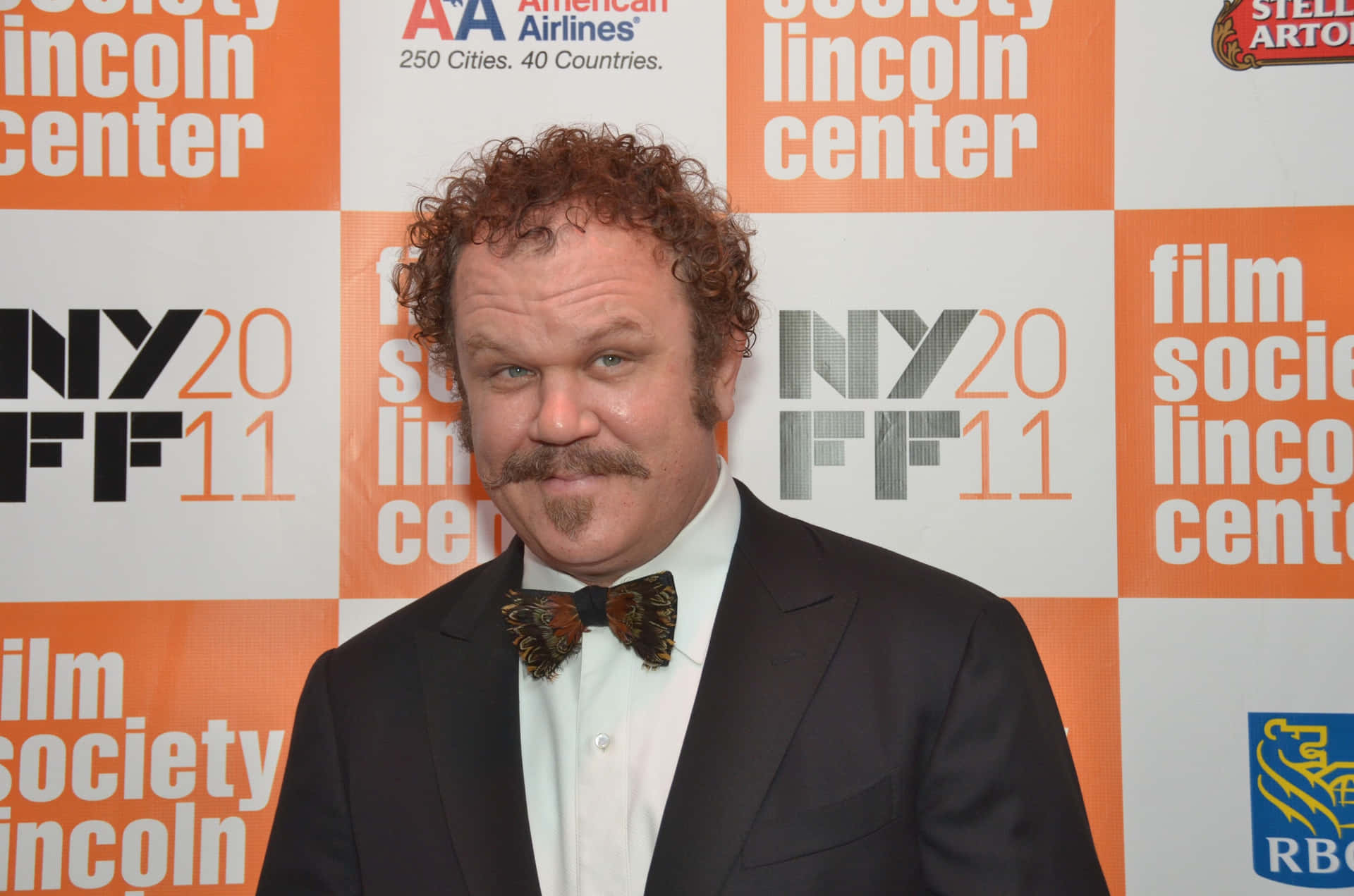 John C. Reilly Striking A Perfect Pose At An Event Background