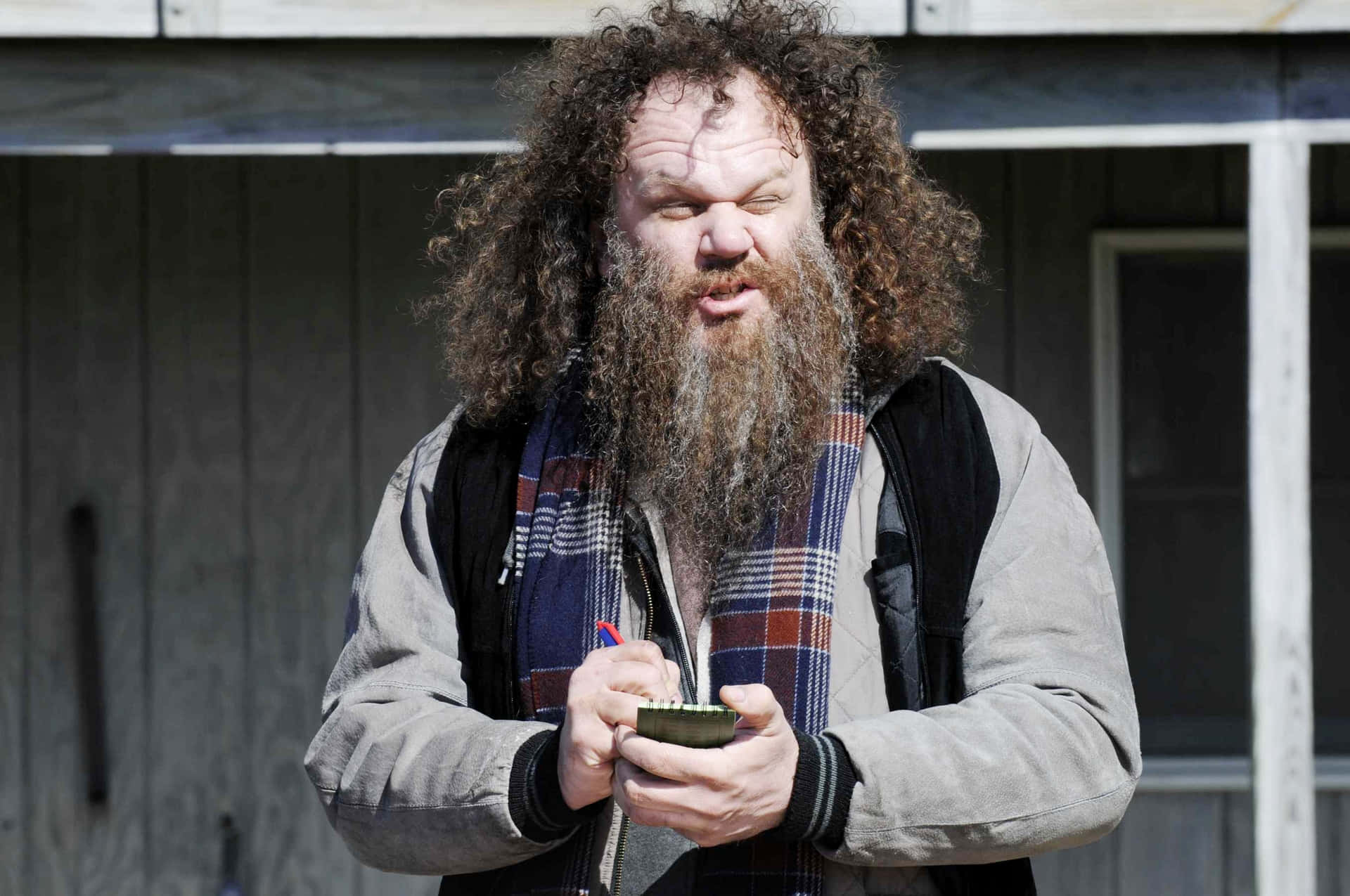 John C. Reilly Striking A Pose During A Photoshoot Background