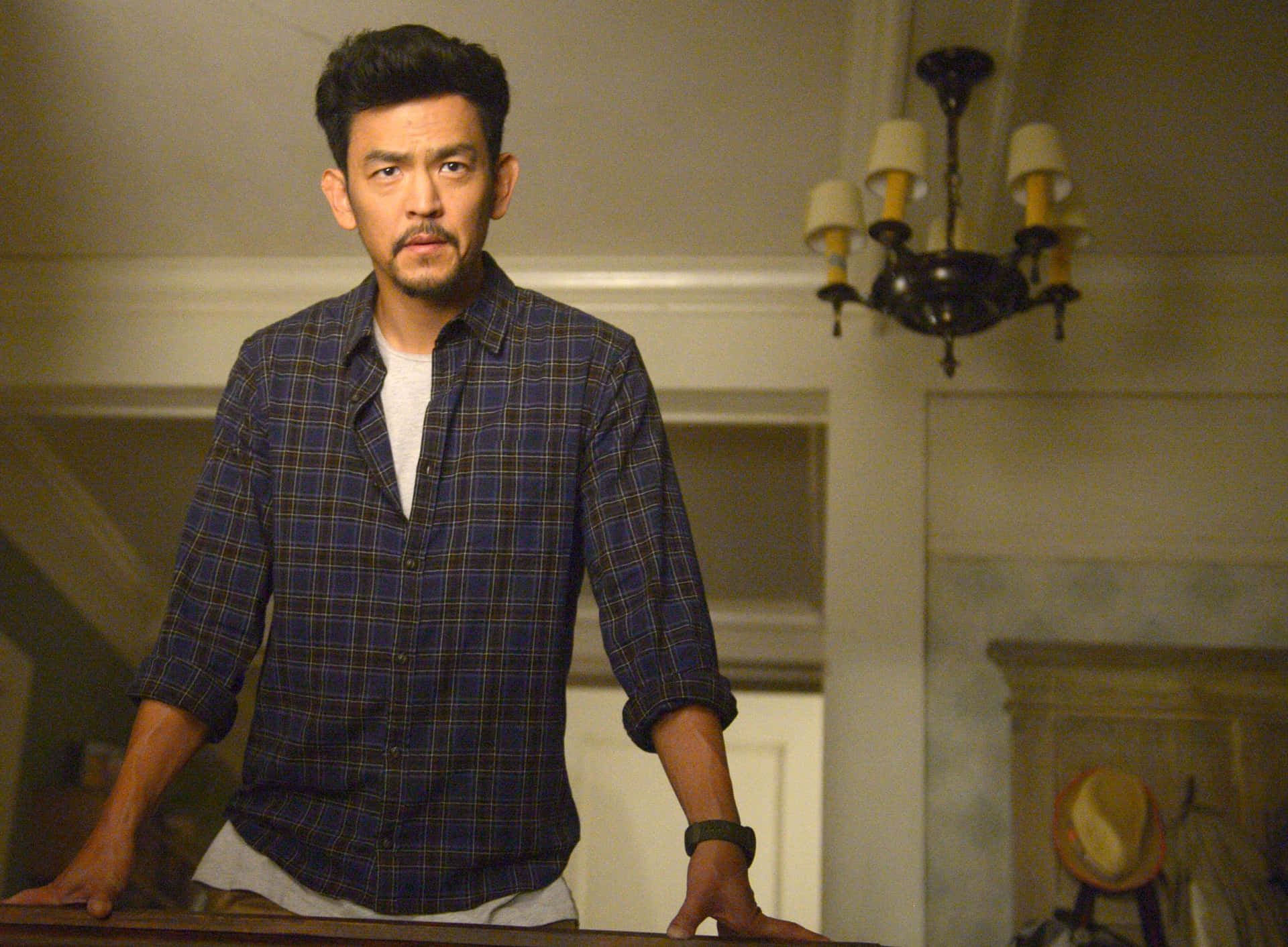 John Cho Posing Confidently For A Portrait Background