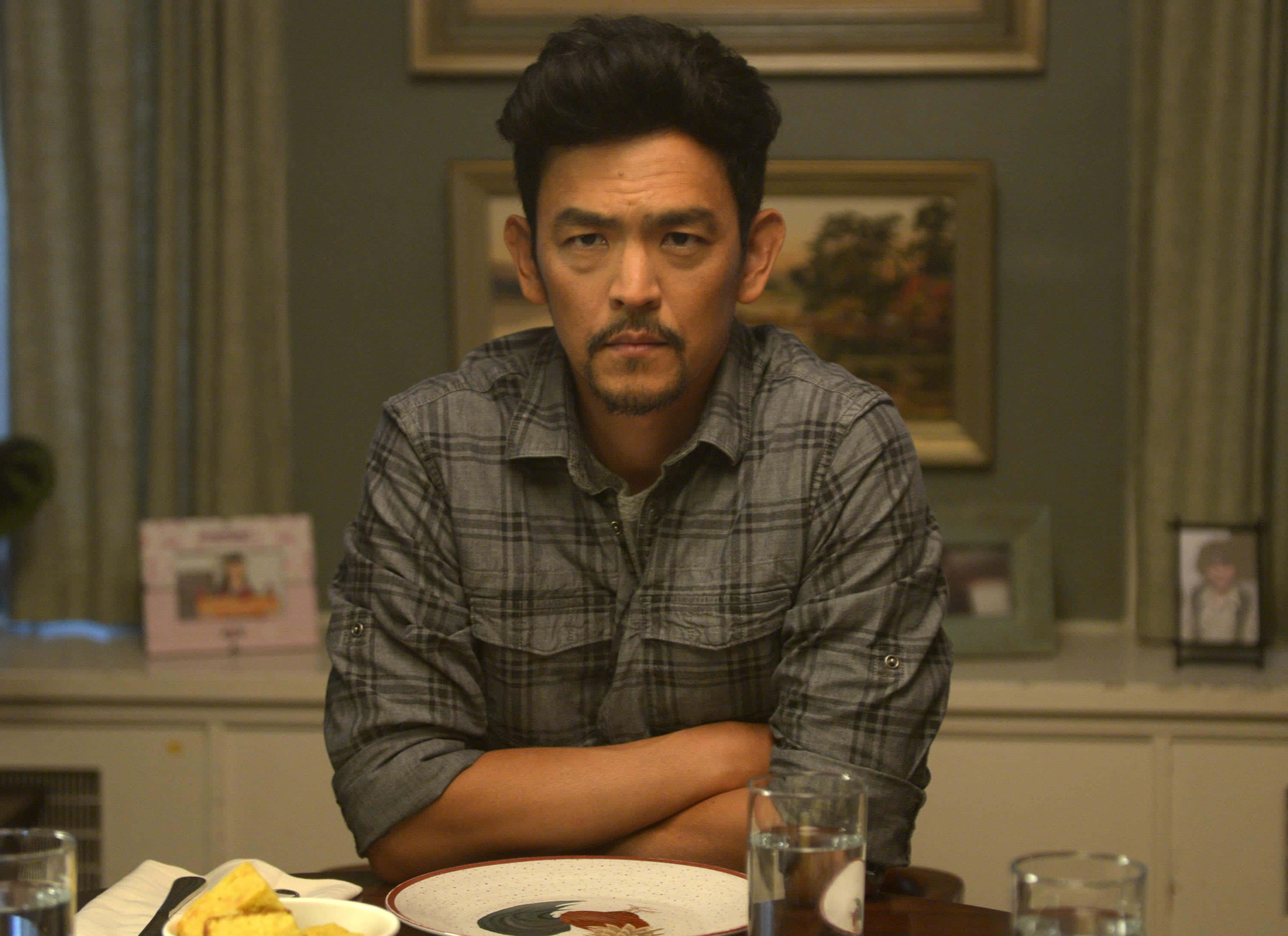 John Cho Posing In A Stylish Photoshoot Background