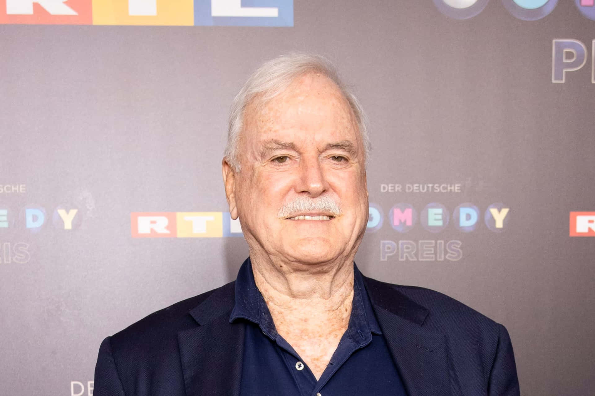 John Cleese Comedy Awards Background