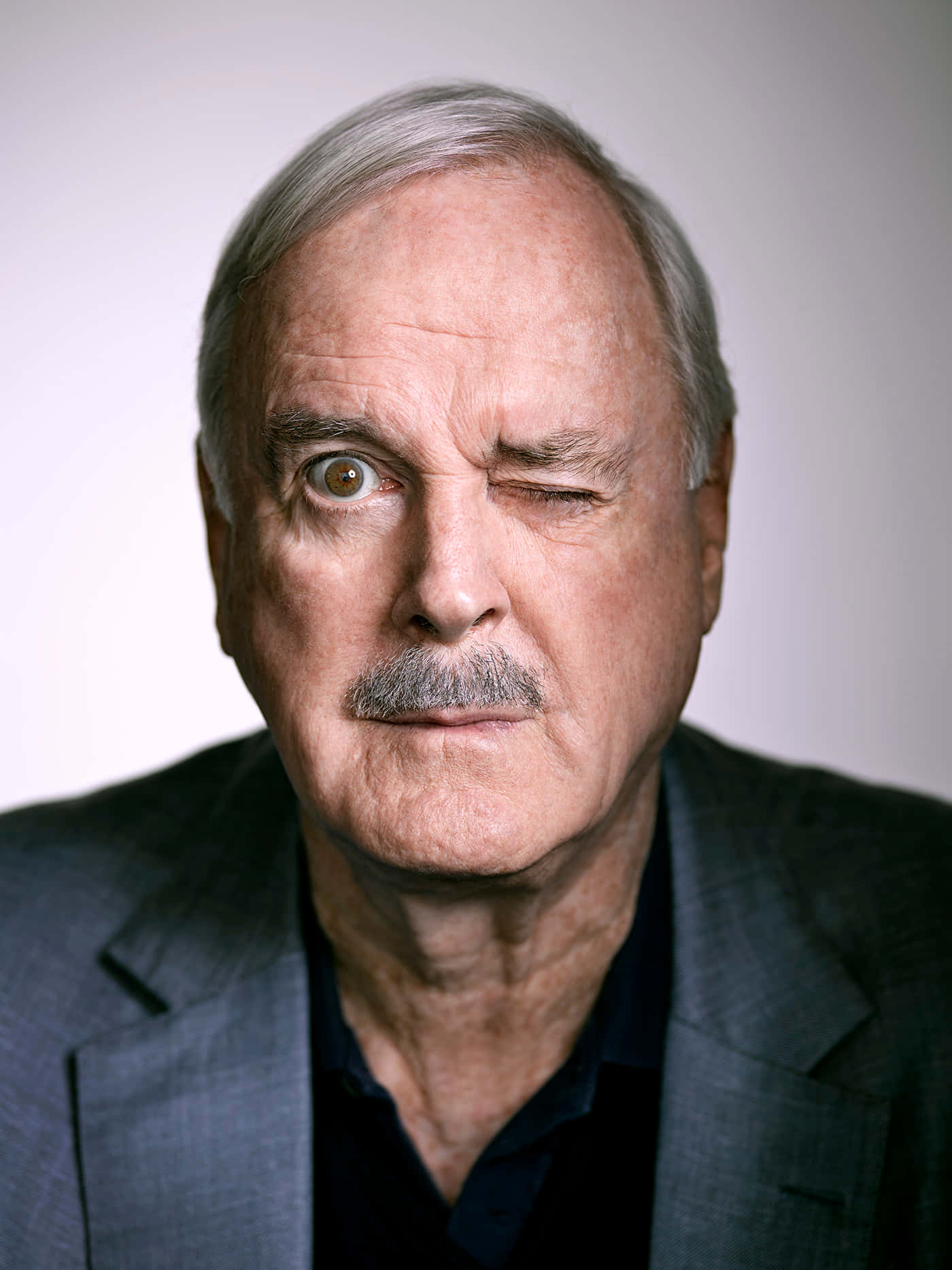 John Cleese Performing On Stage