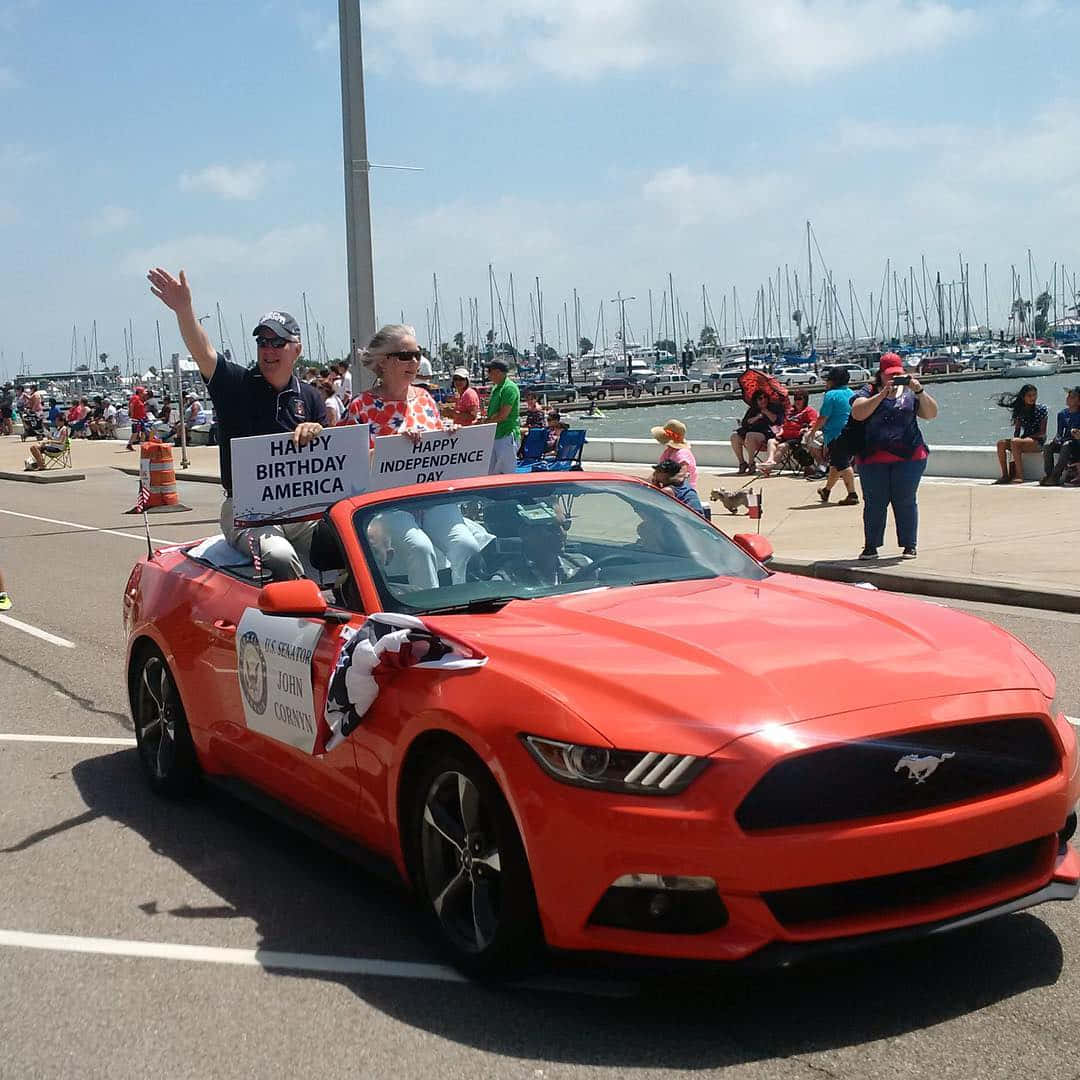 John Cornyn Riding On A Car