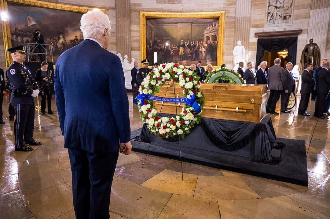 John Cornyn Standing Before A Casket