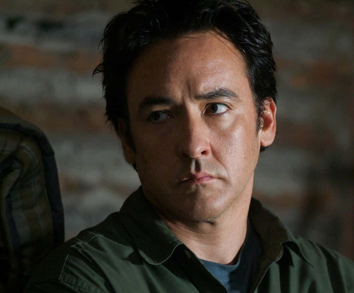 John Cusack In A Contemplative Pose Background