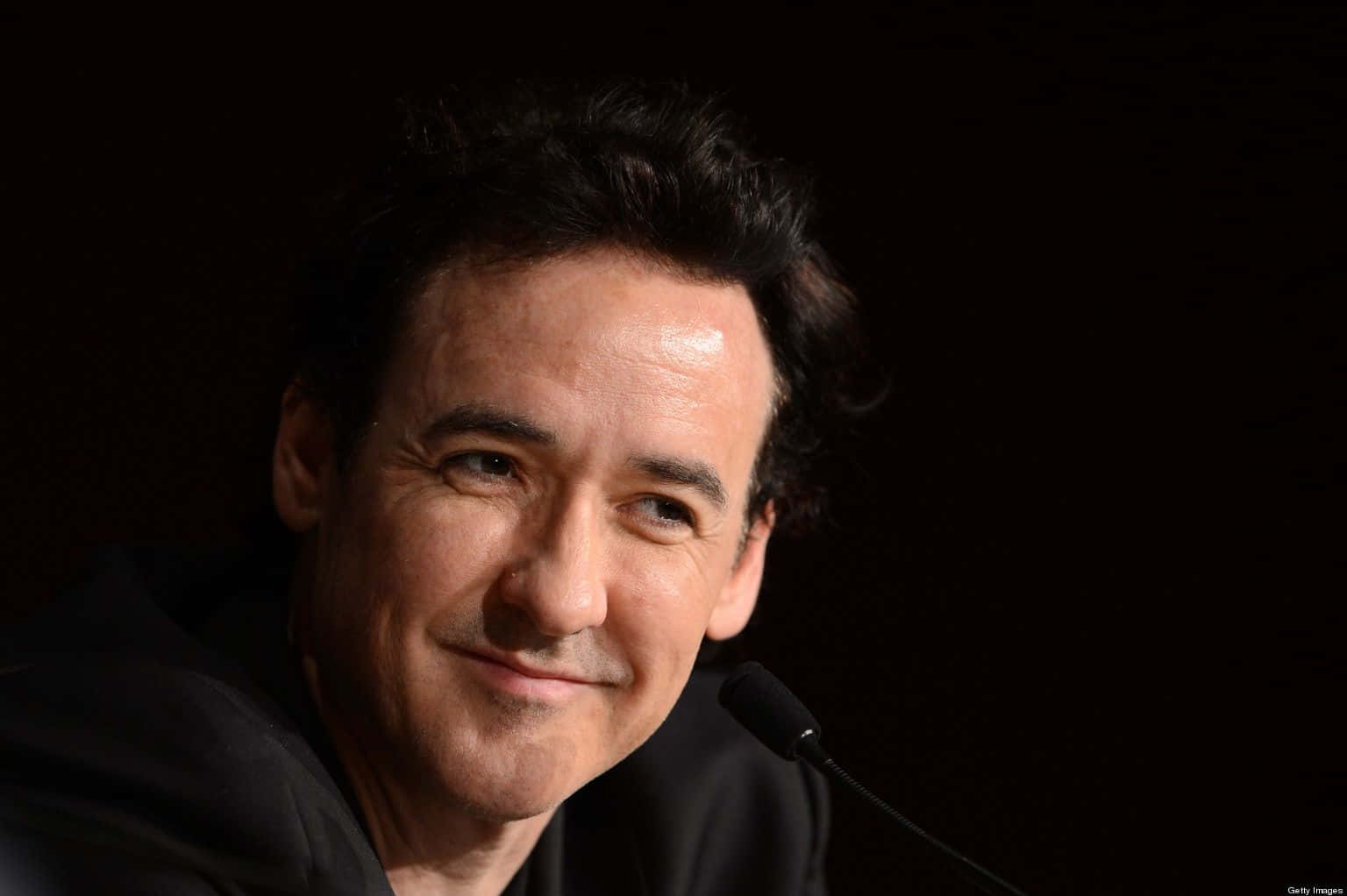 John Cusack In A Stylish Attire Background