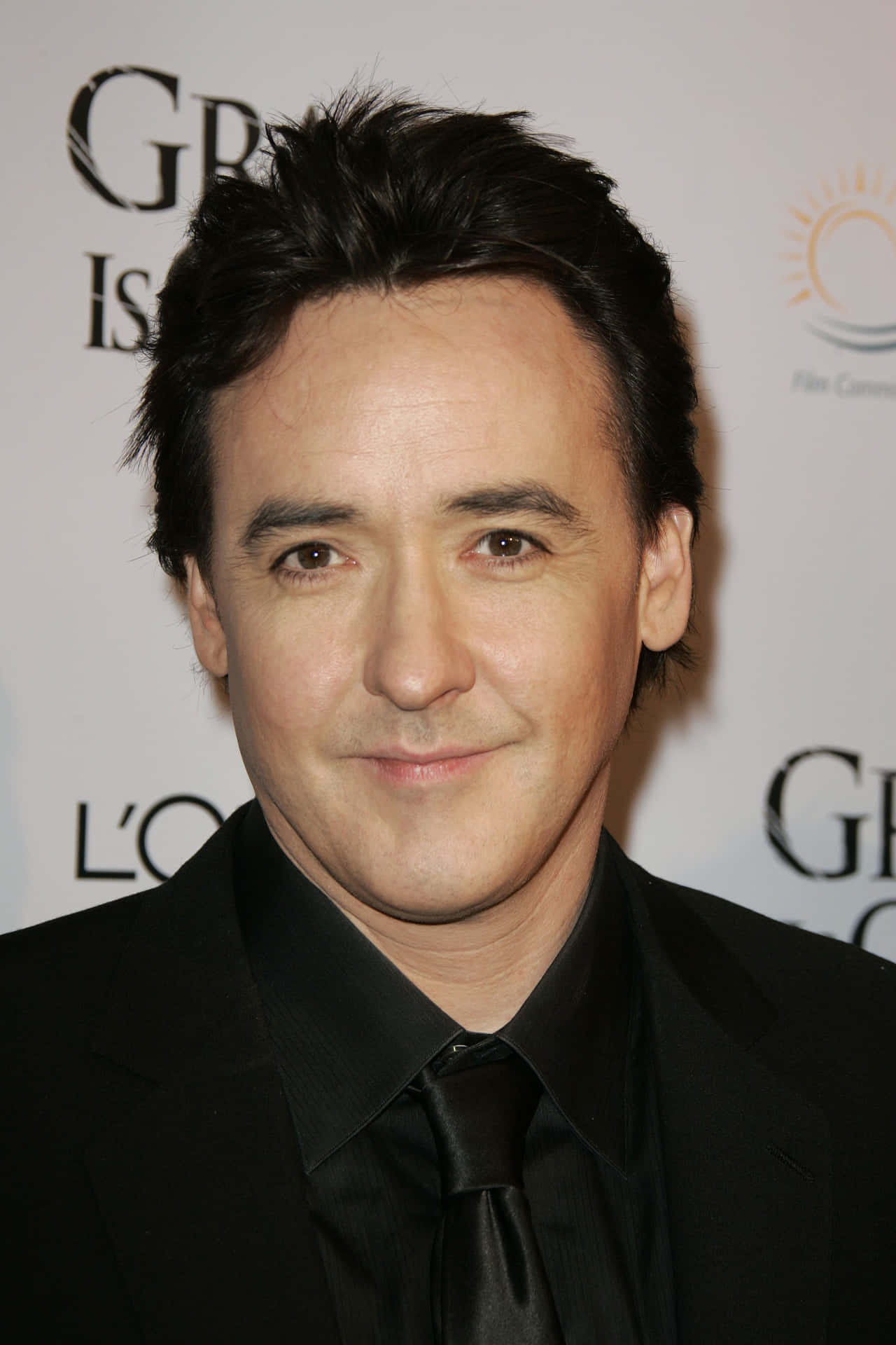 John Cusack Posing For A Portrait Background