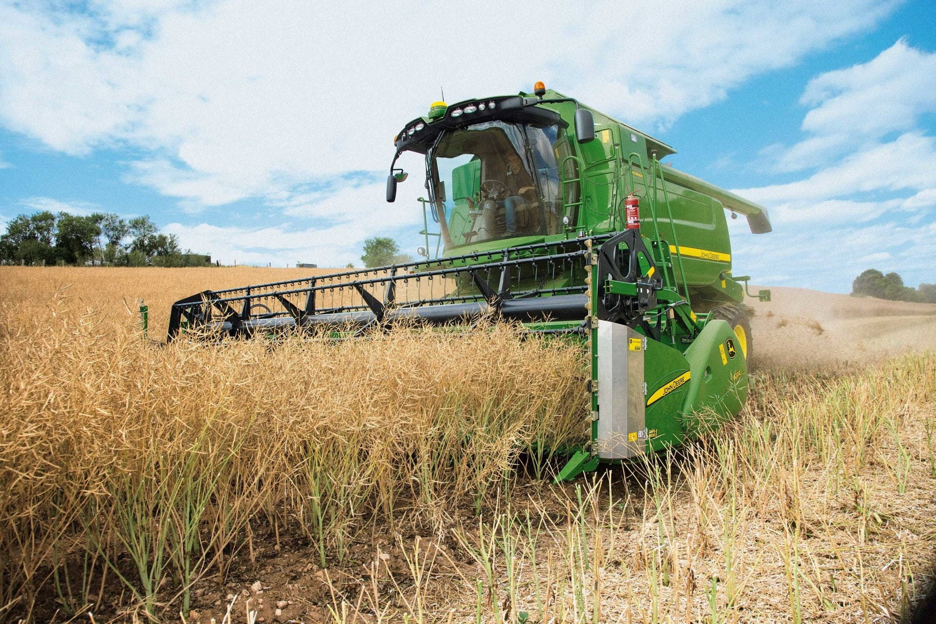 John Deere Machine Harvesting Wheat Field Background