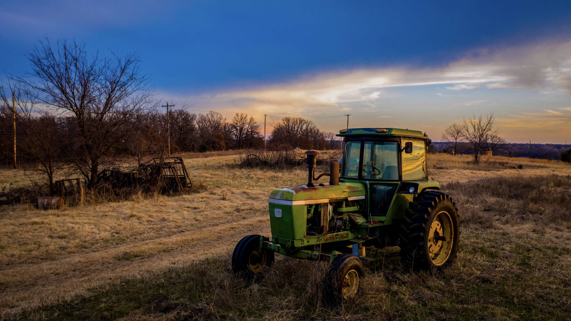 John Deere Tractor At Sundown Background