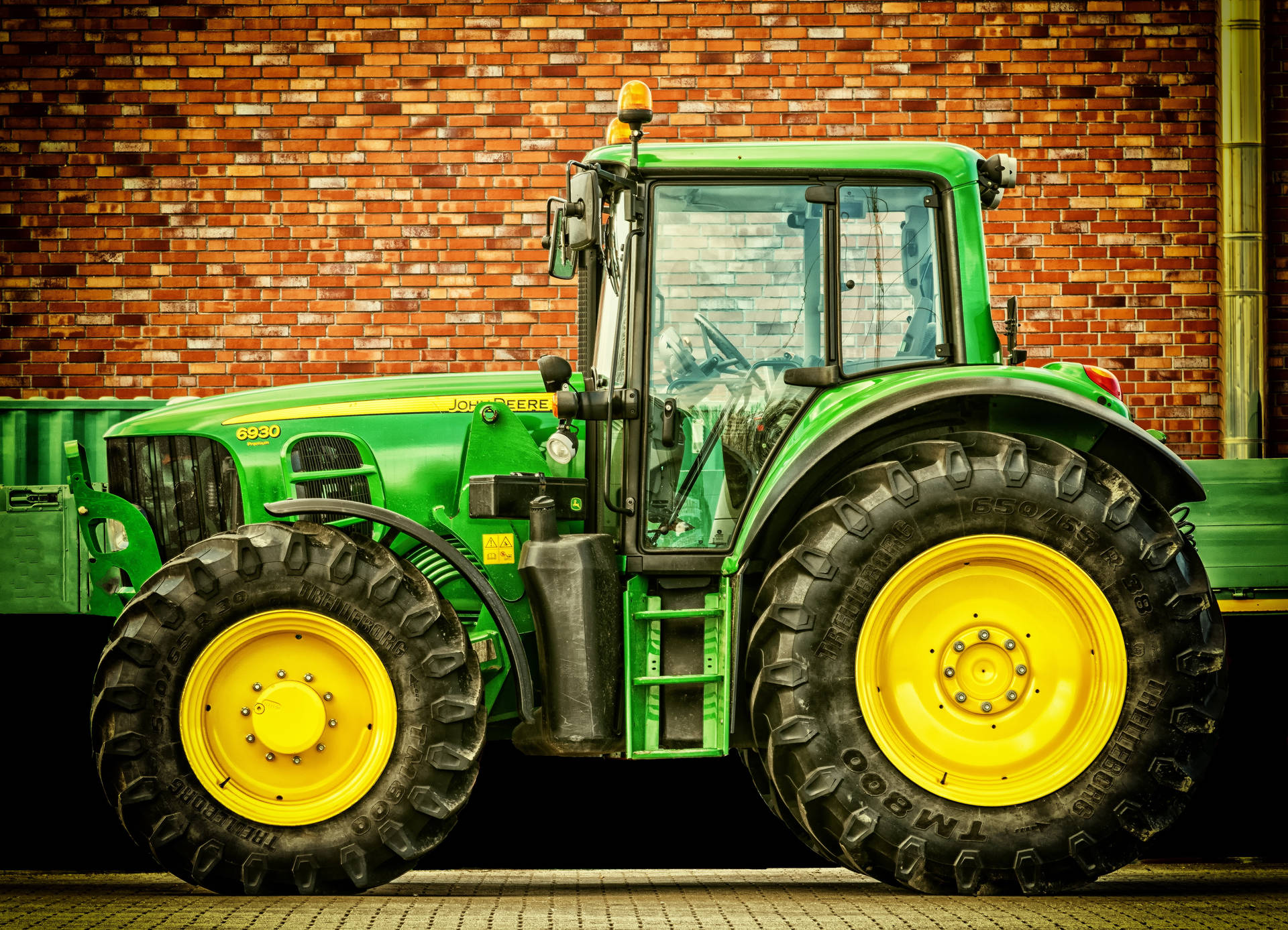 John Deere Tractor With Brick Wall Background