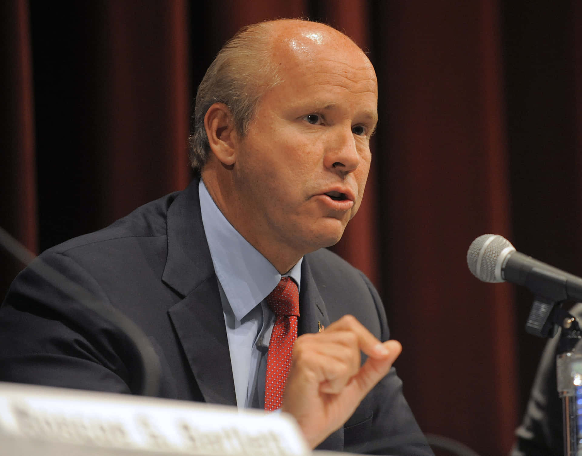 John Delaney Delivers A Speech During A Campaign Event. Background