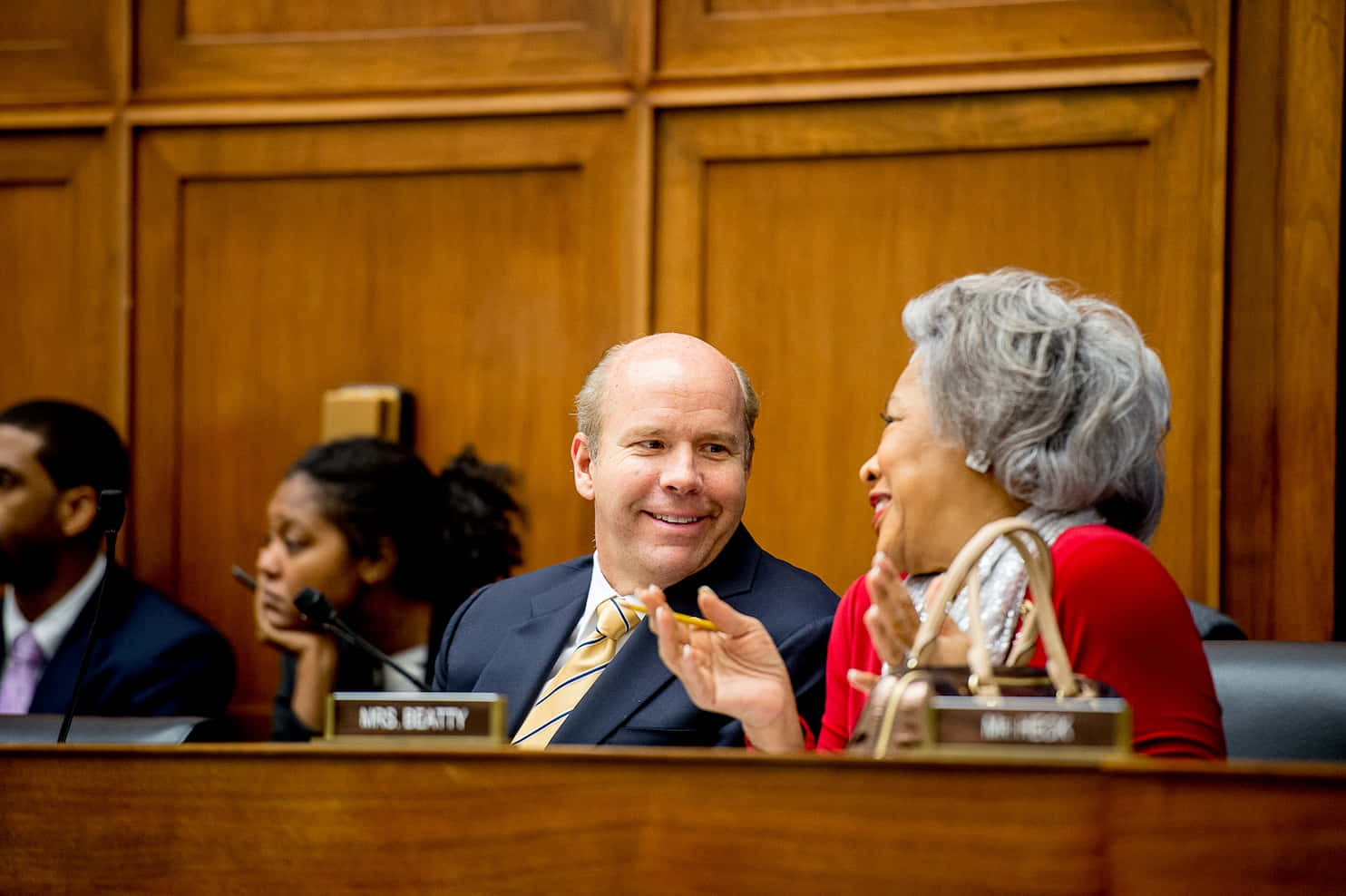 John Delaney Engaging In A Passionate Conversation Background