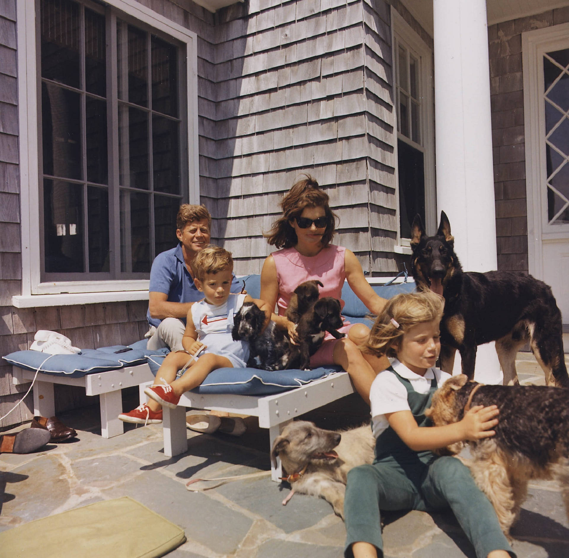 John F. Kennedy With His Family In An Intimate Home Scene Background