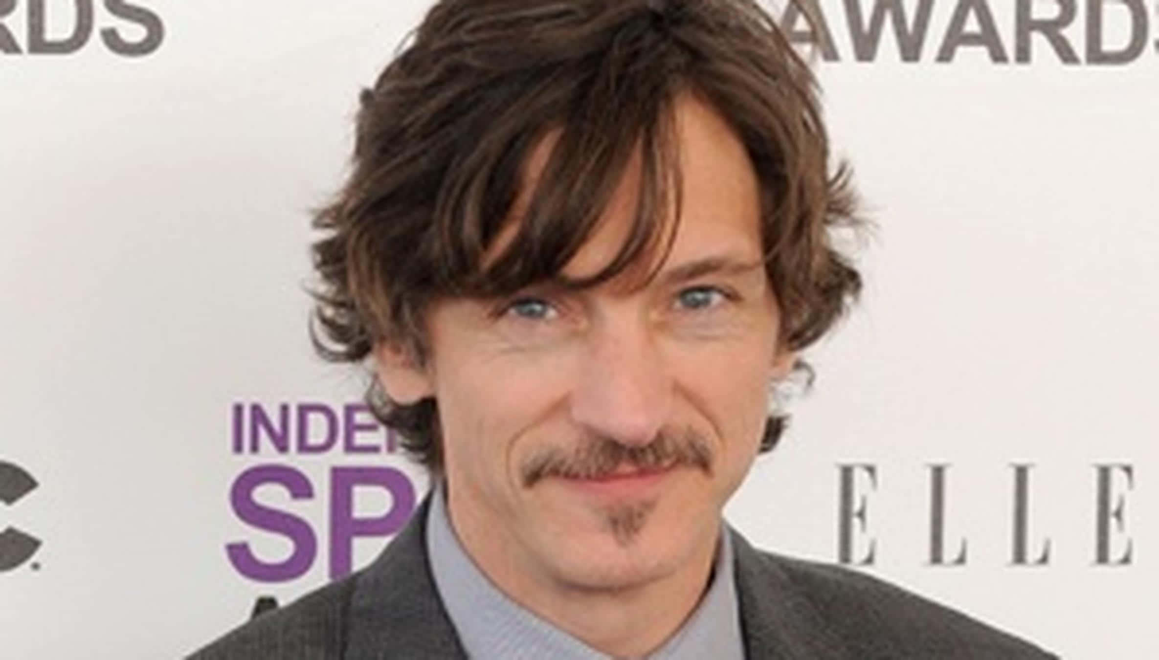 John Hawkes In A Thought-provoking Pose Background
