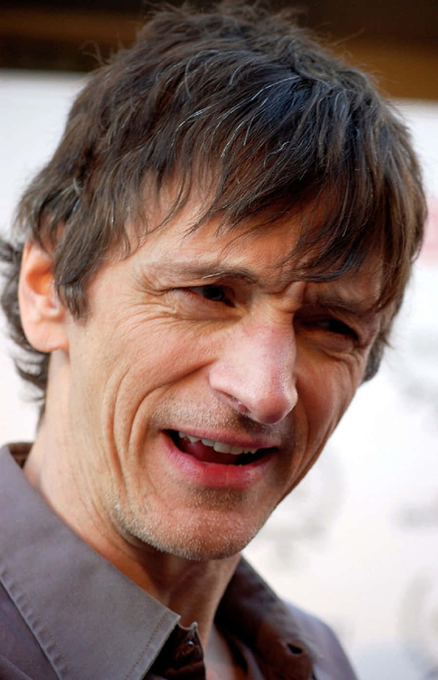 John Hawkes Posing In A Casual Photoshoot Background