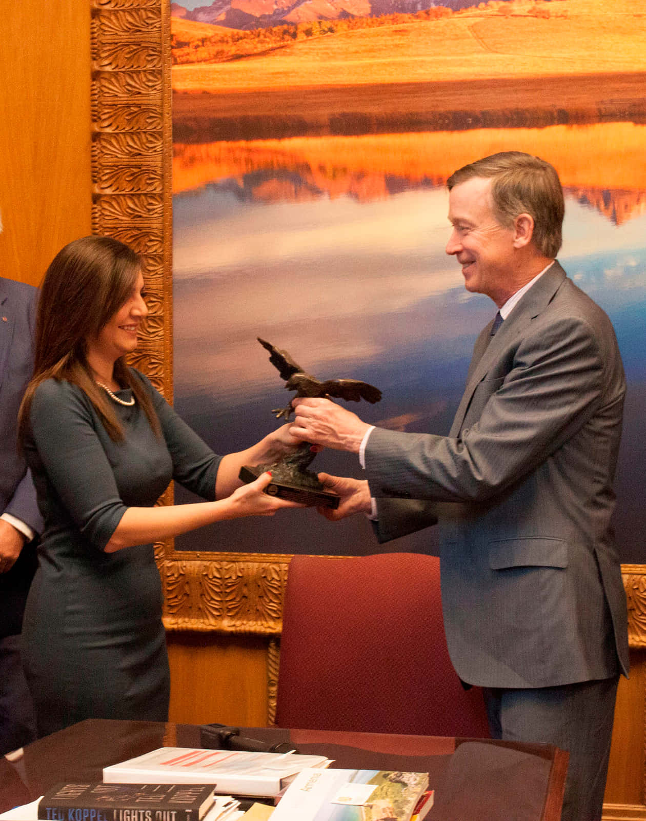 John Hickenlooper Being Handed An Eagle Trophy
