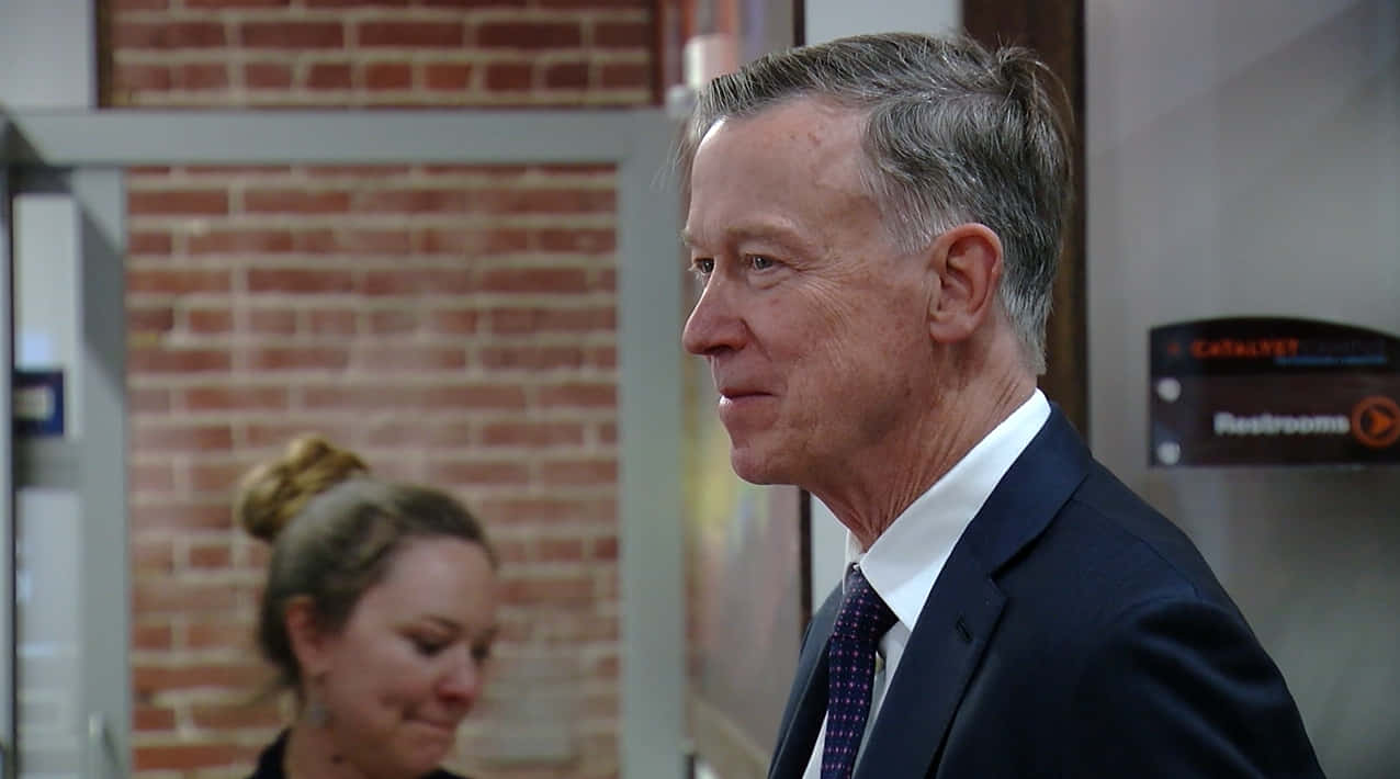 John Hickenlooper In A Dark Blue Suit