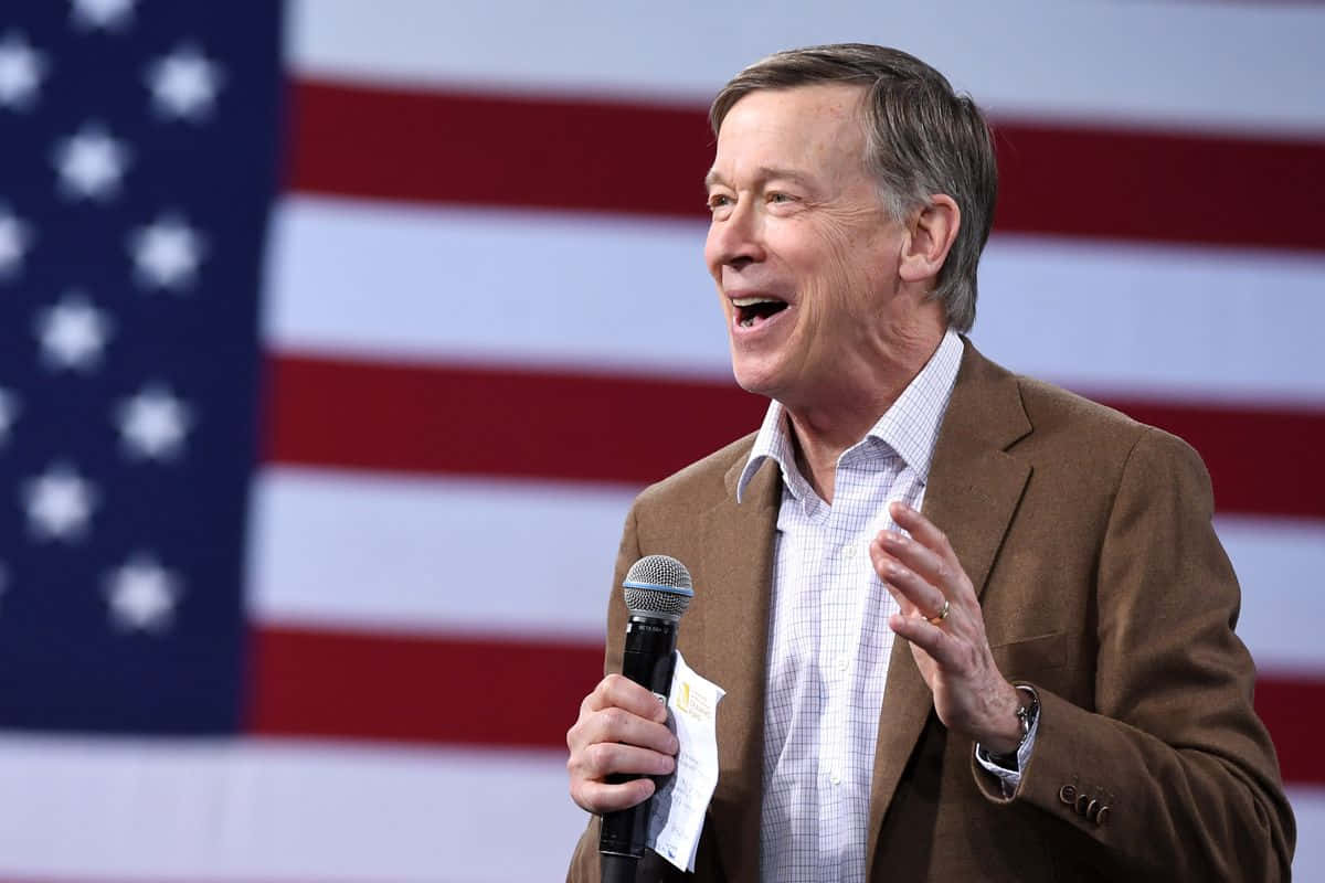 John Hickenlooper In Front Of The American Flag