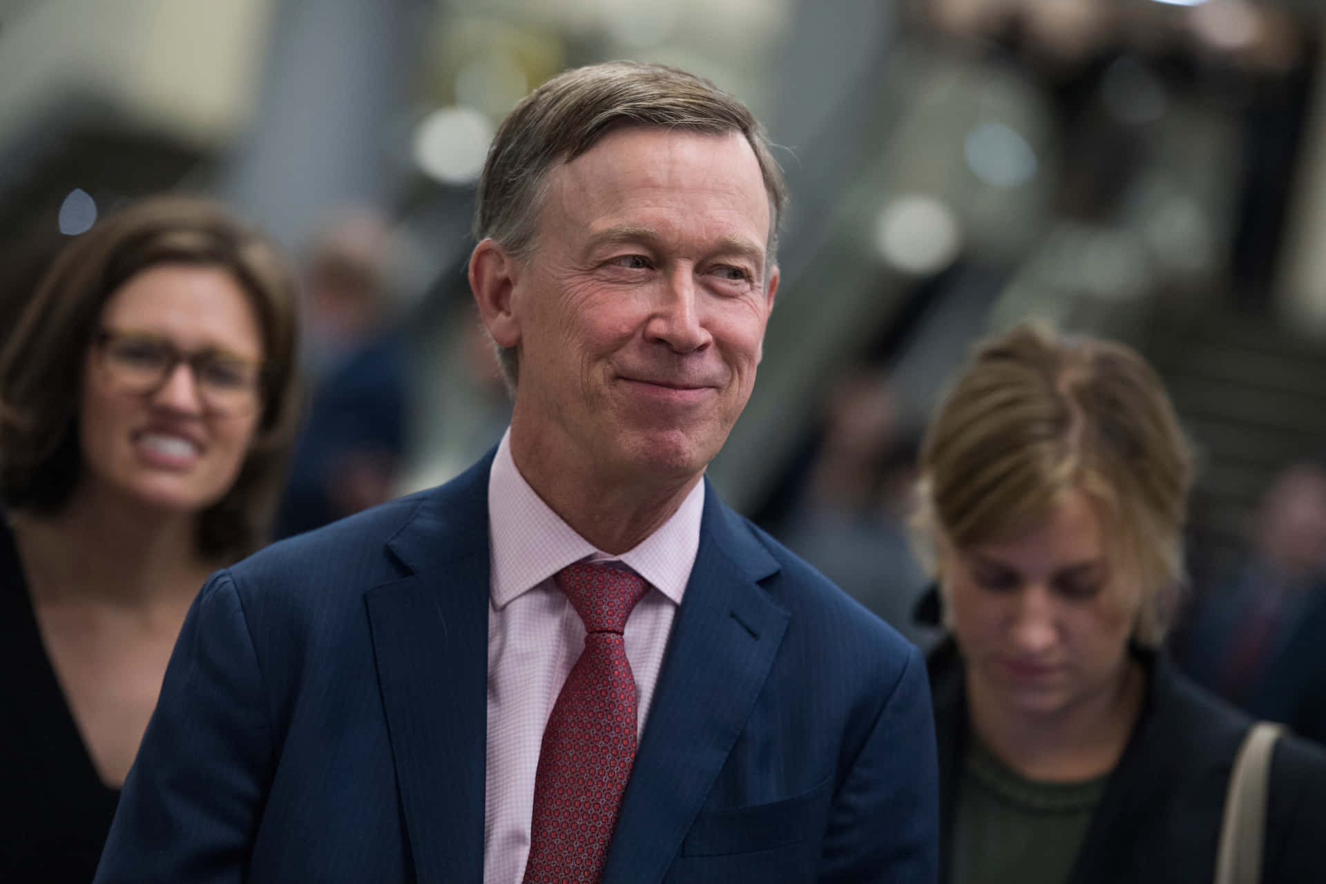 John Hickenlooper Looking To The Right Background