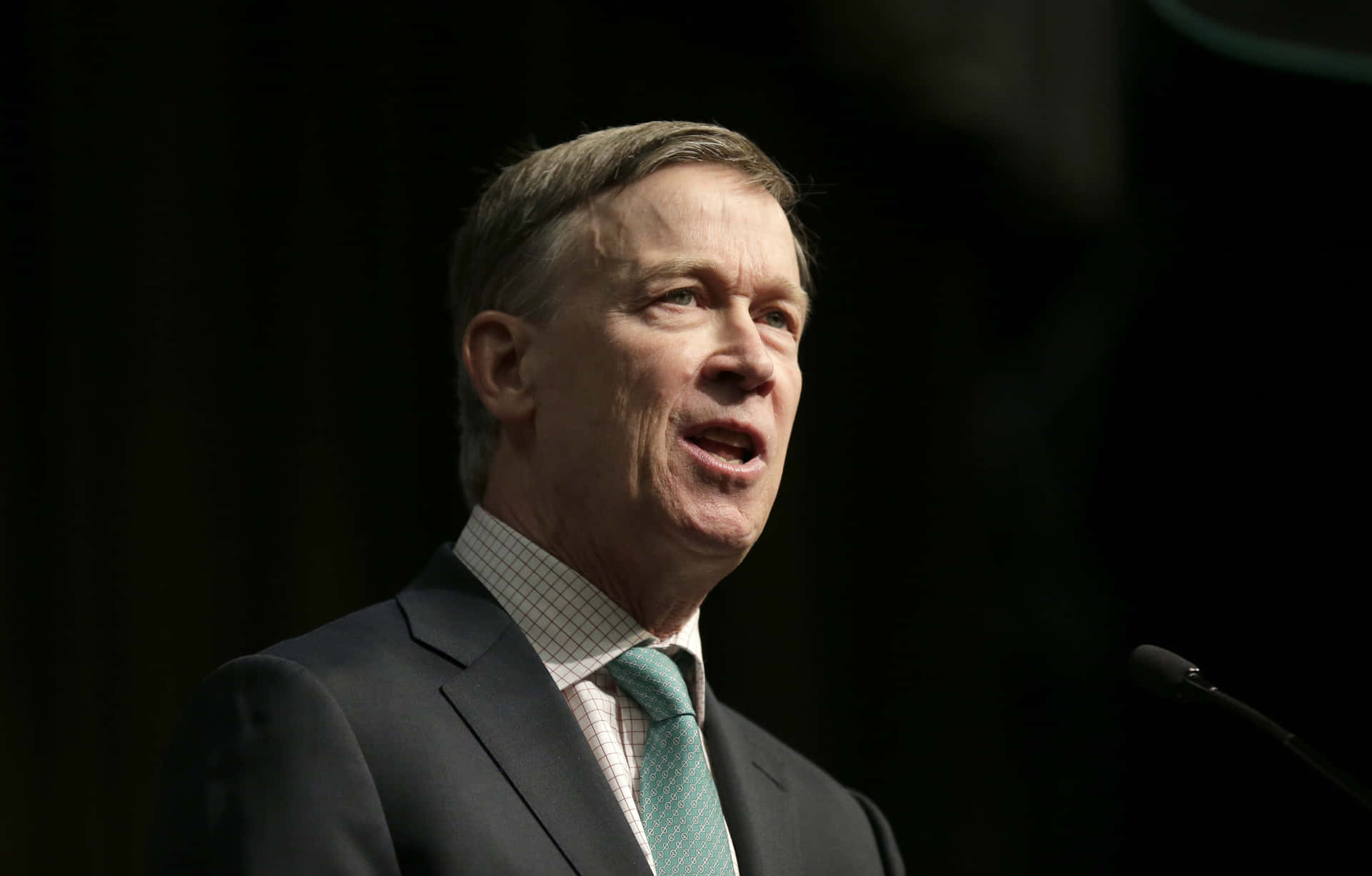 John Hickenlooper Looking Towards Right With Black Background