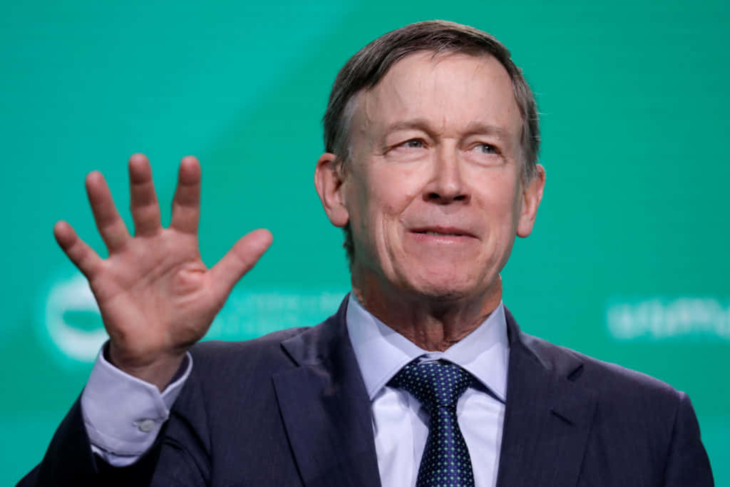 John Hickenlooper With A Cyan Background