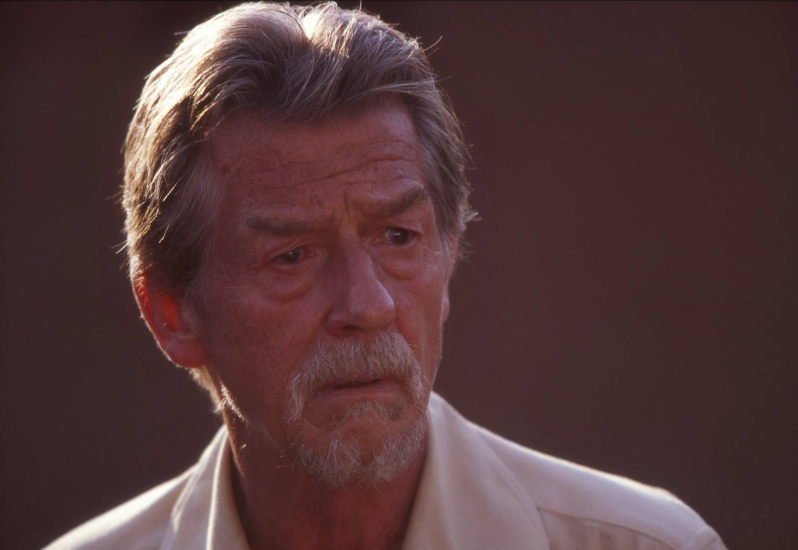 John Hurt Gray Hair Sad Background