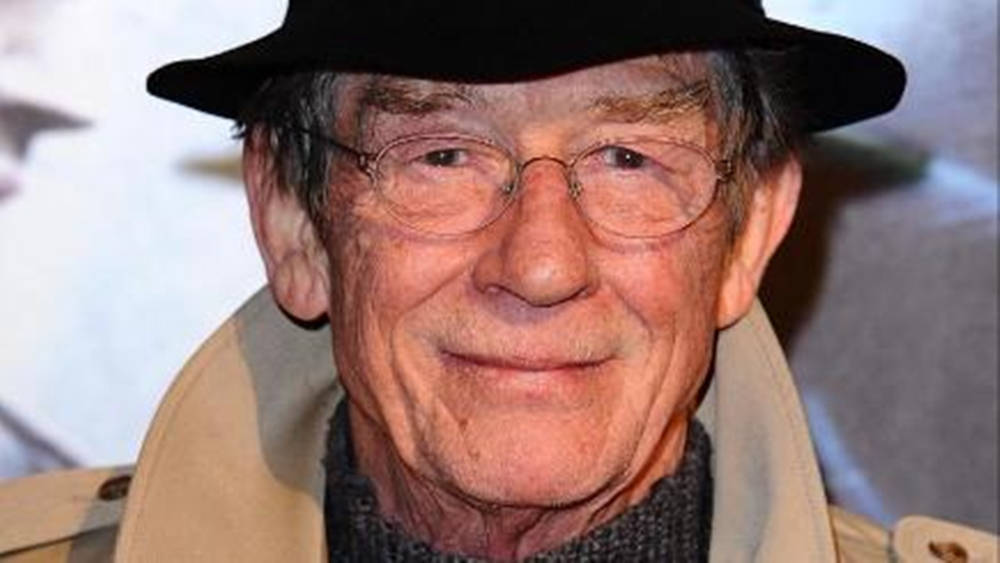 John Hurt Smiling Glasses And Hat