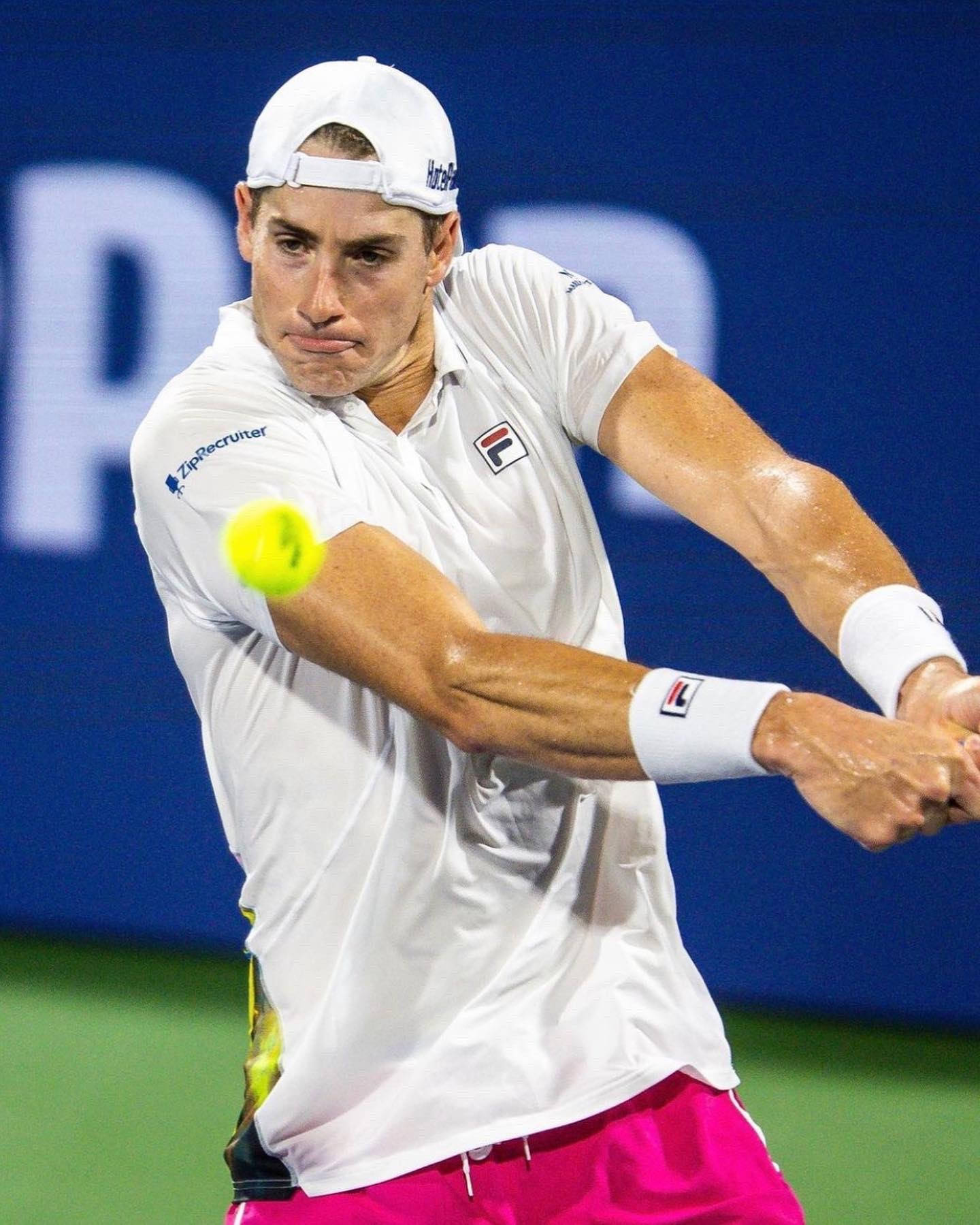 John Isner In Action - Striving For Excellence In Tennis Background