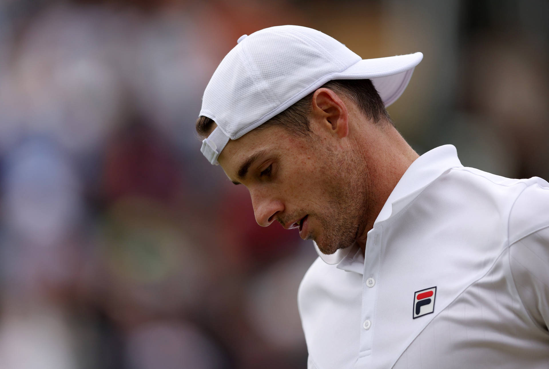 John Isner In White Tennis Cap Background