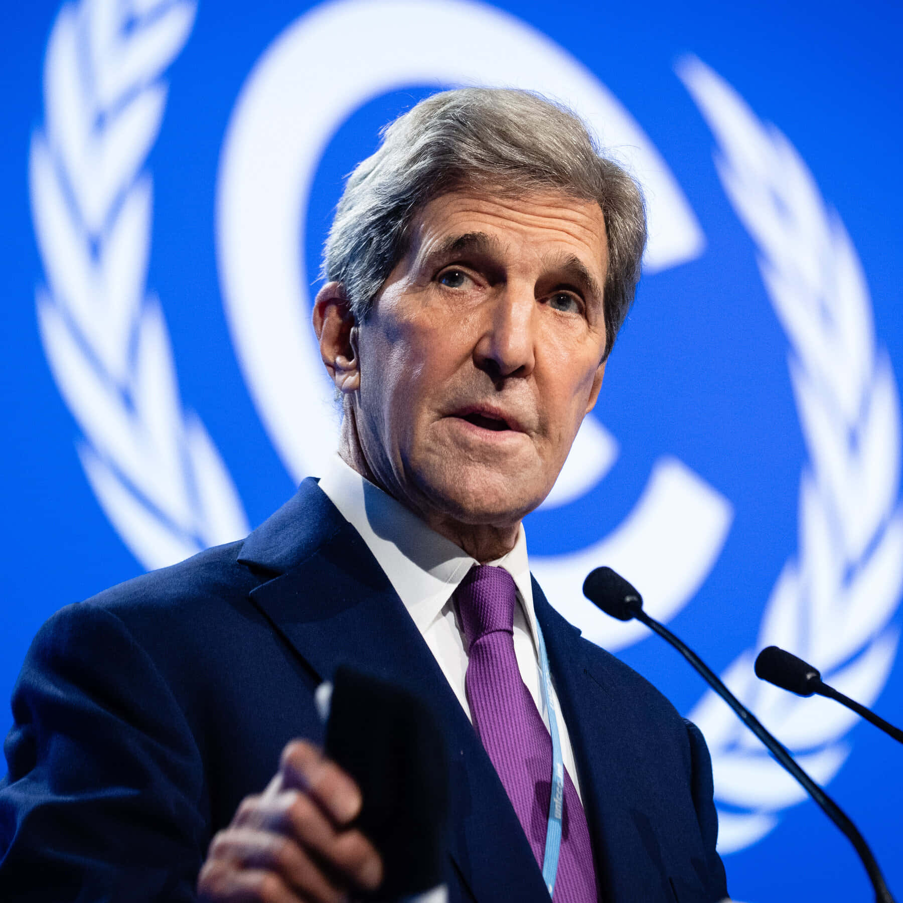 John Kerry Delivering A Speech At The Cop26 Climate Summit Background