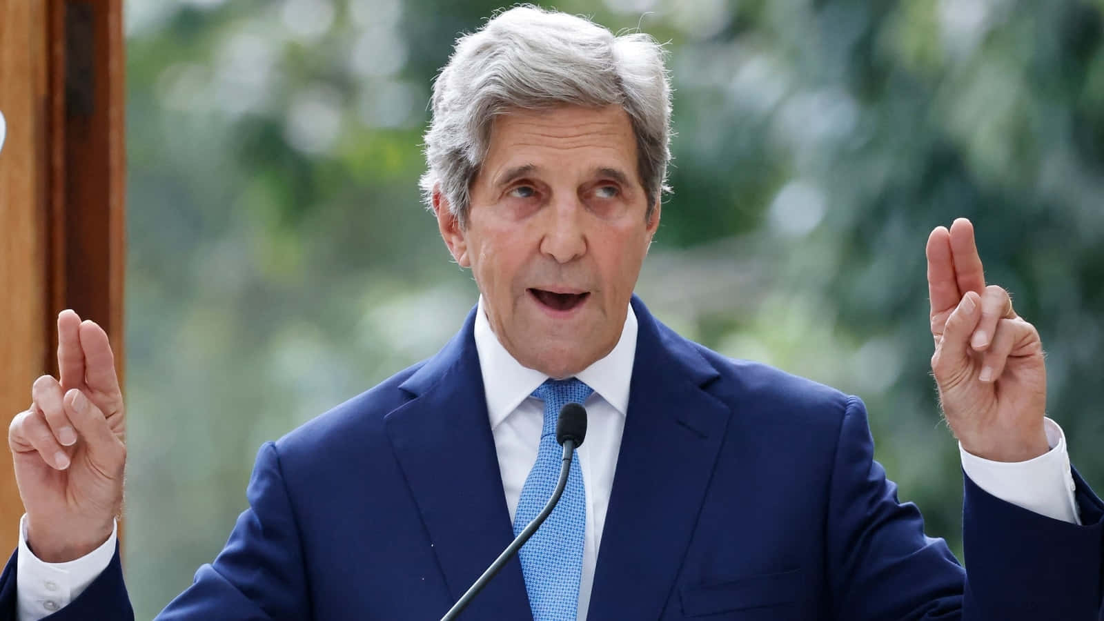 John Kerry Making A Quoting Hand Gesture Background