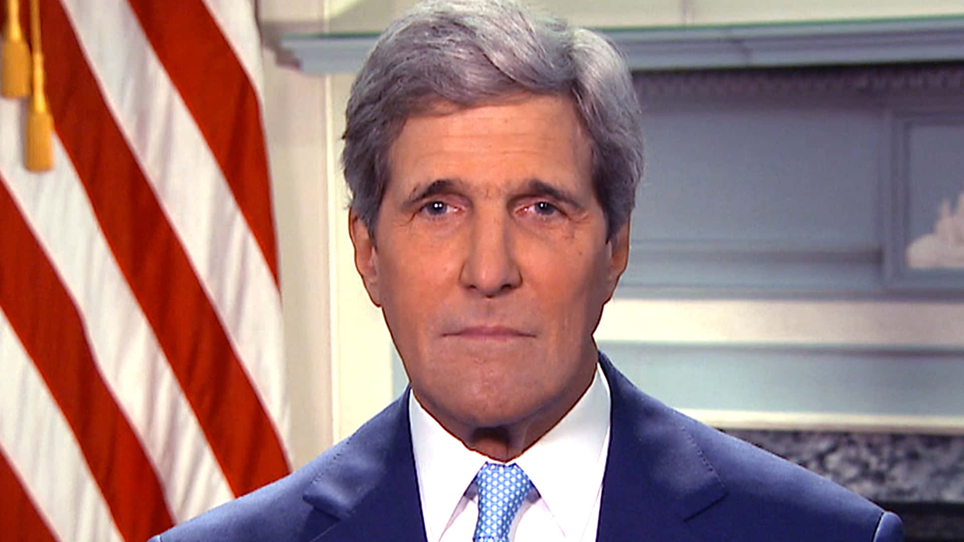 John Kerry With American Flag Background