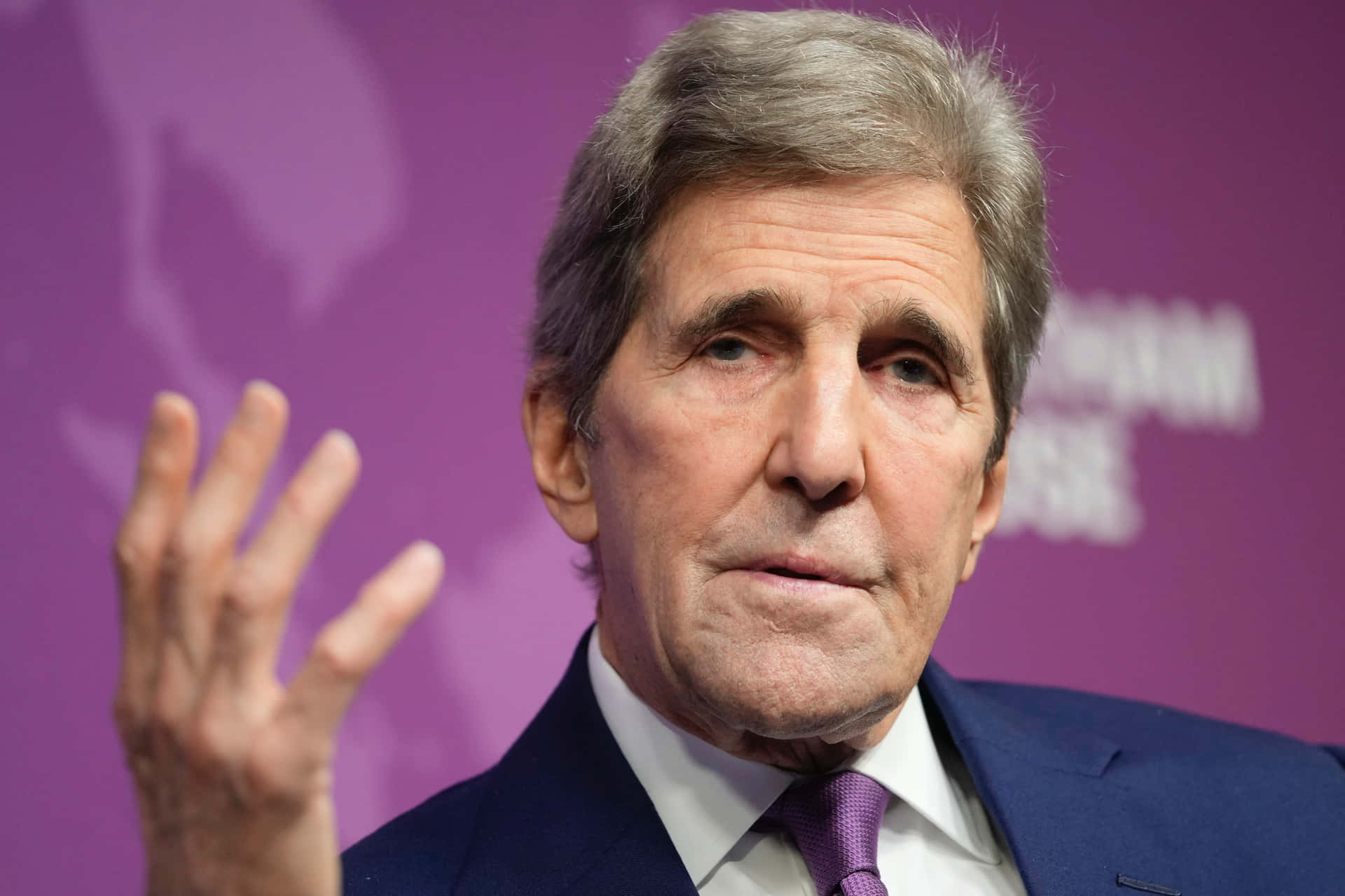 John Kerry With One Hand Up