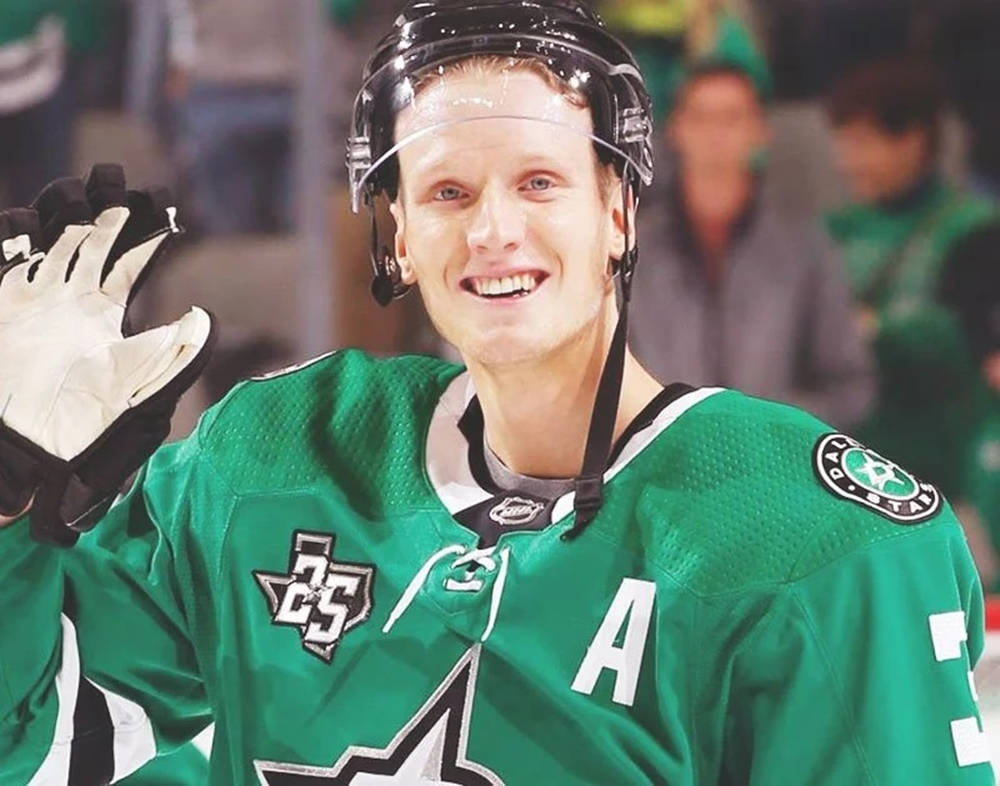 John Klingberg In Action For The Dallas Stars Background