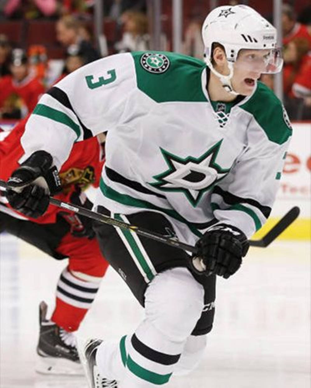 John Klingberg In Action On Ice Background