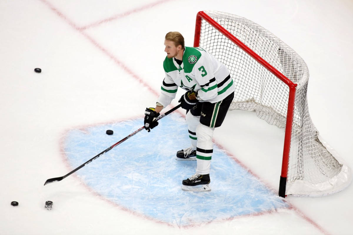 John Klingberg Practice Defending Goal Post Background