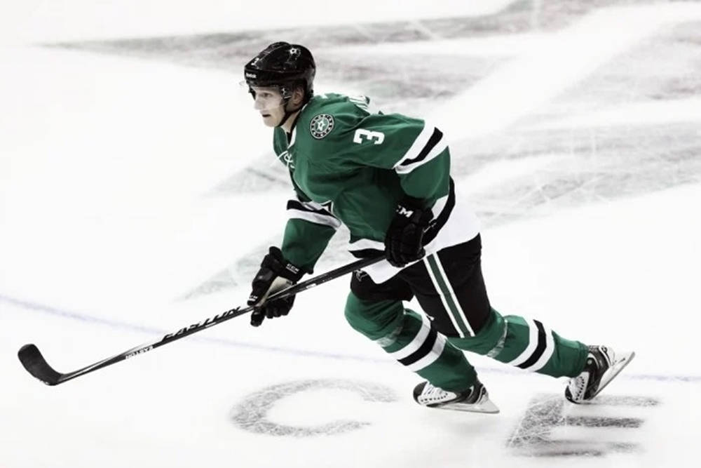 John Klingberg - Unleashing Power On Ice Background