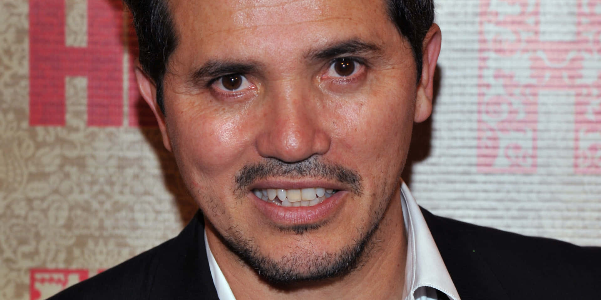 John Leguizamo In A Promotional Photo Shoot Background