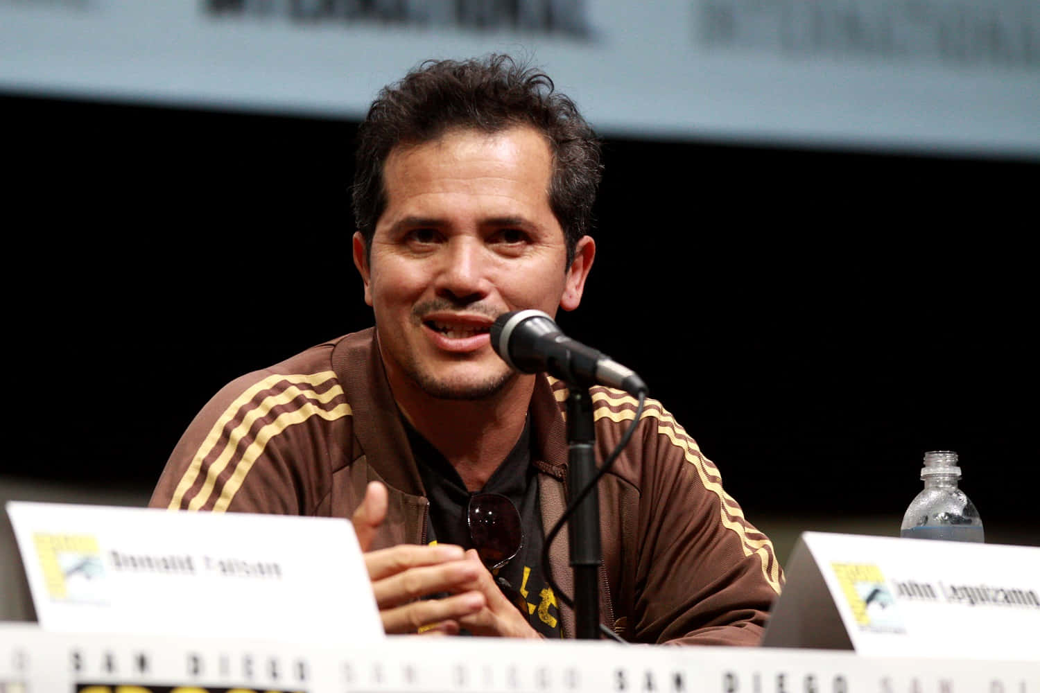 John Leguizamo On Film Set Background