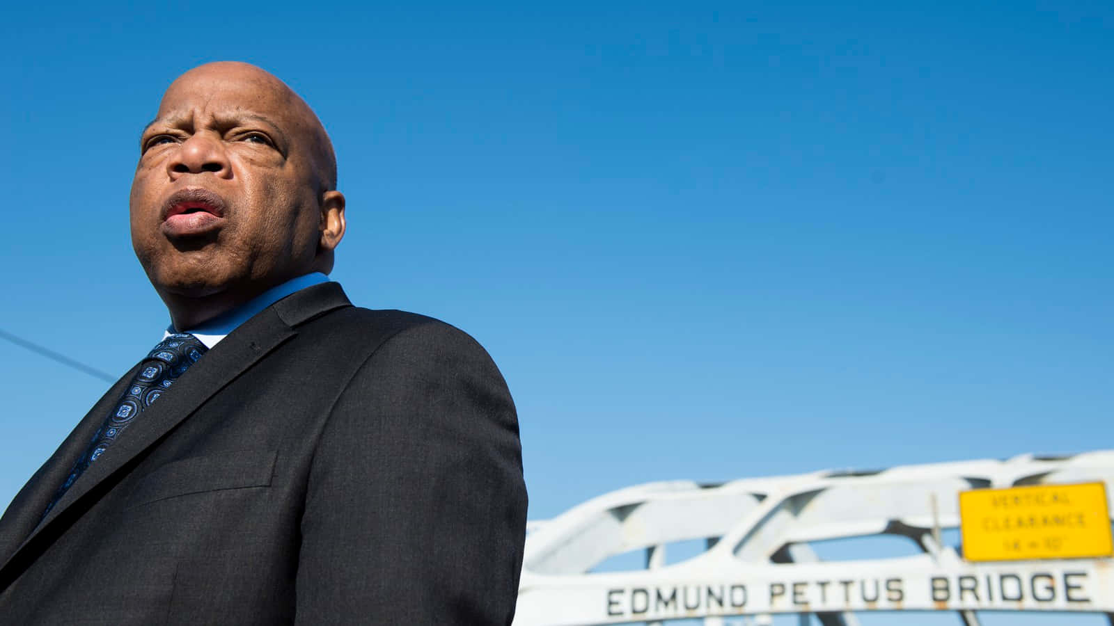 John Lewis Standing On The Edmund Pettus Bridge Background